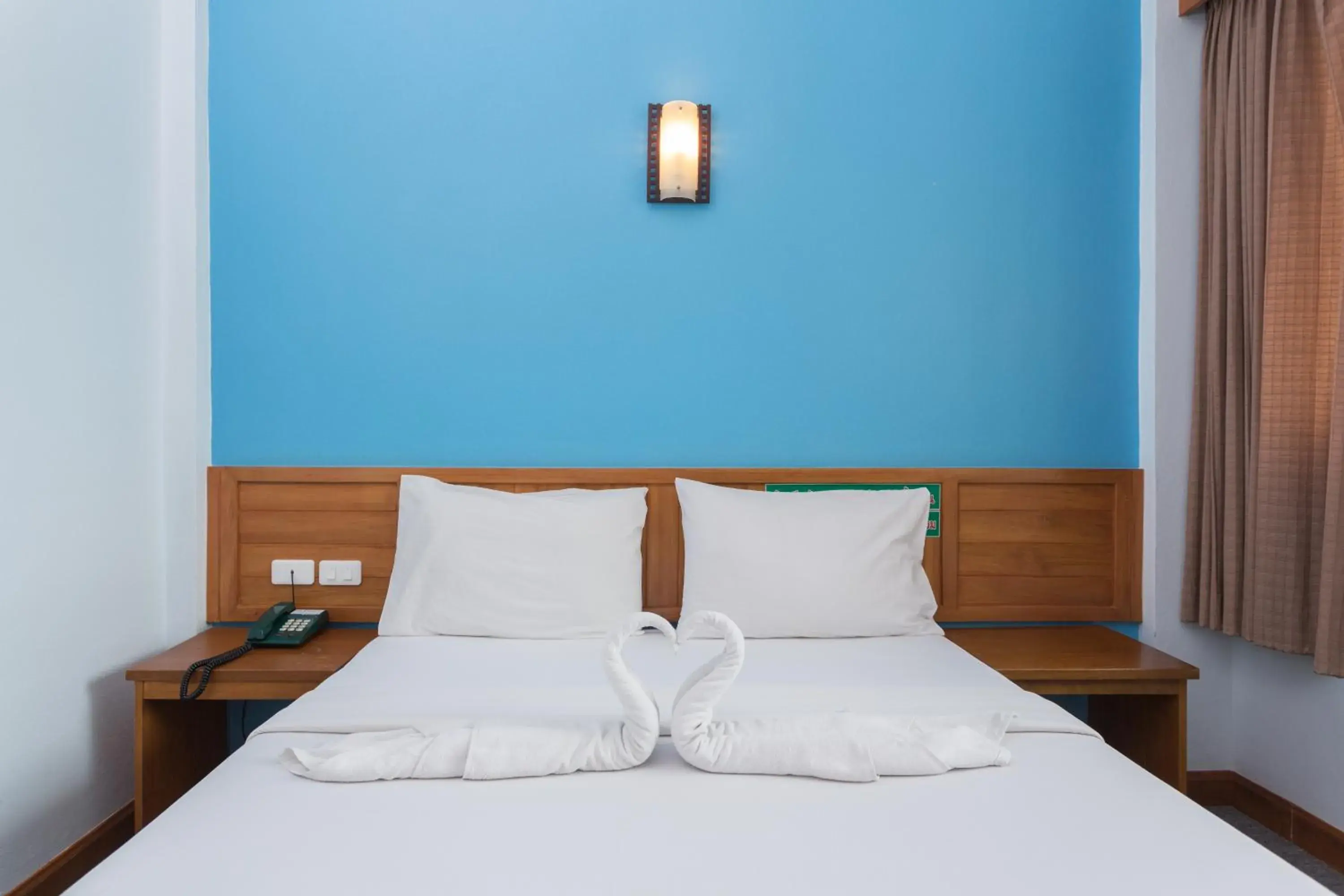 Bed, Room Photo in Riverside Hotel