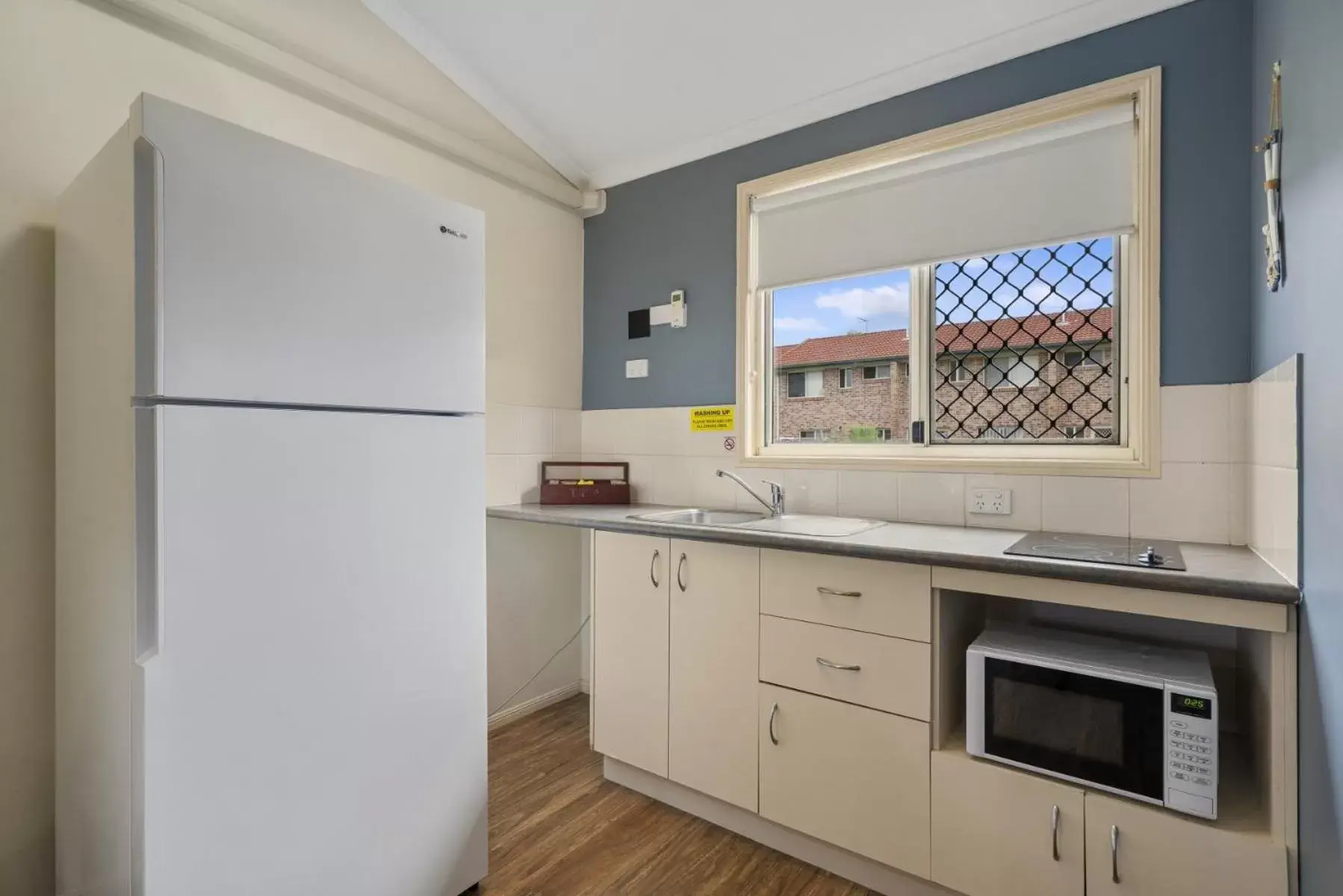 Kitchen or kitchenette, Kitchen/Kitchenette in Caboolture Central Motor Inn, Sure Stay Collection by BW