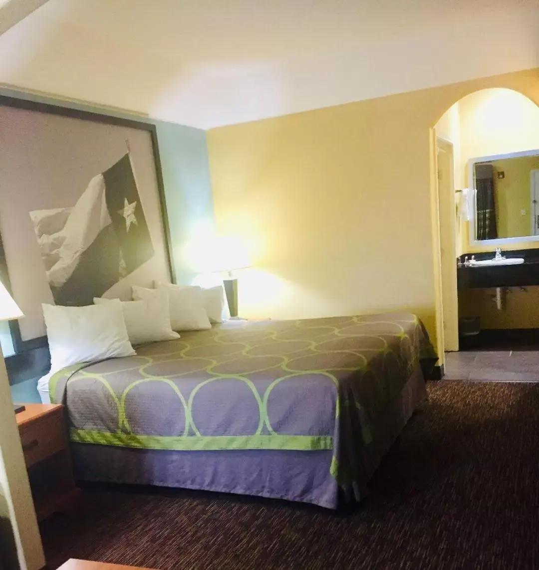 Bed in Super 8 by Wyndham Montgomery/ Lake Conroe