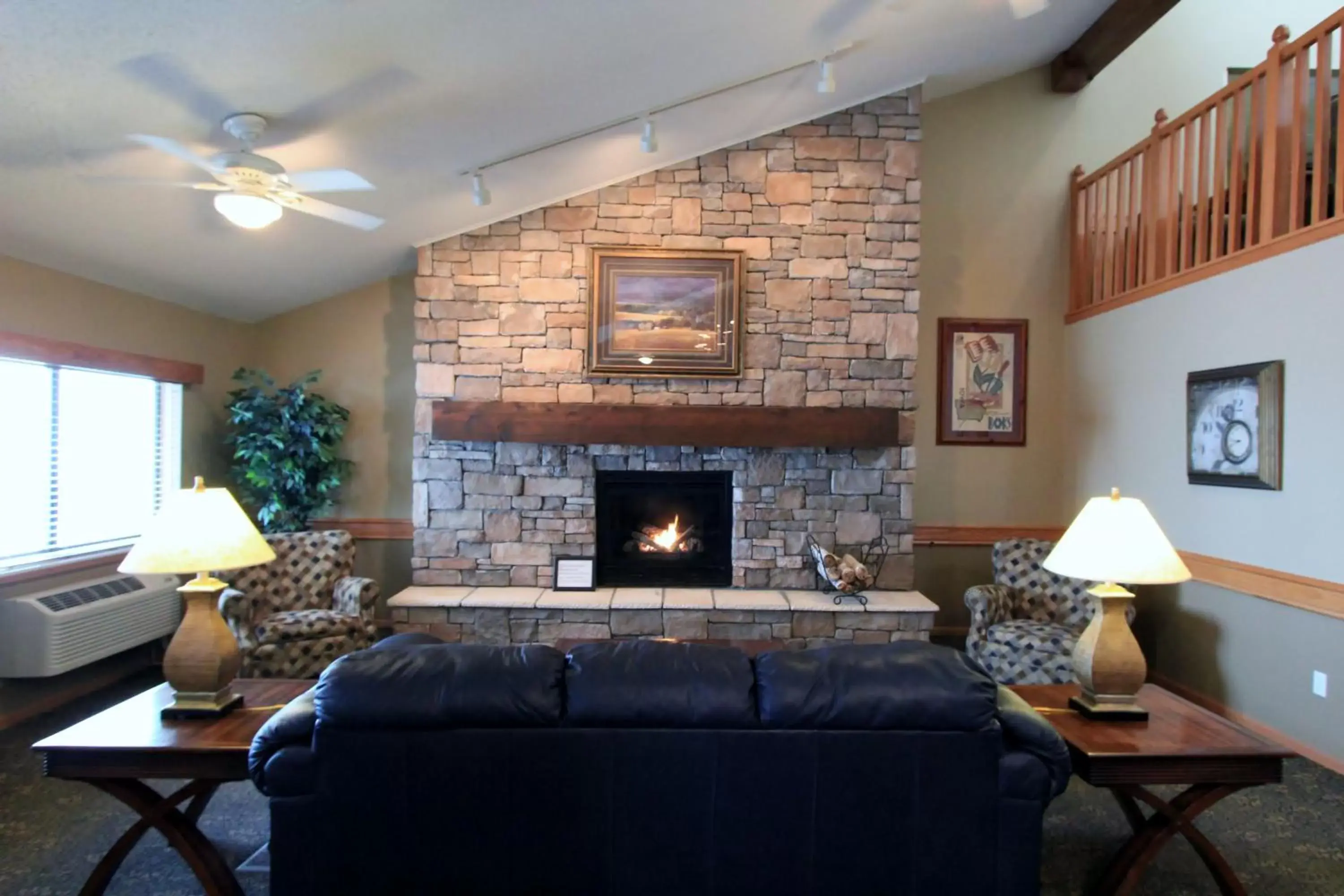 Living room, Seating Area in AmericInn by Wyndham Cedar Rapids Airport