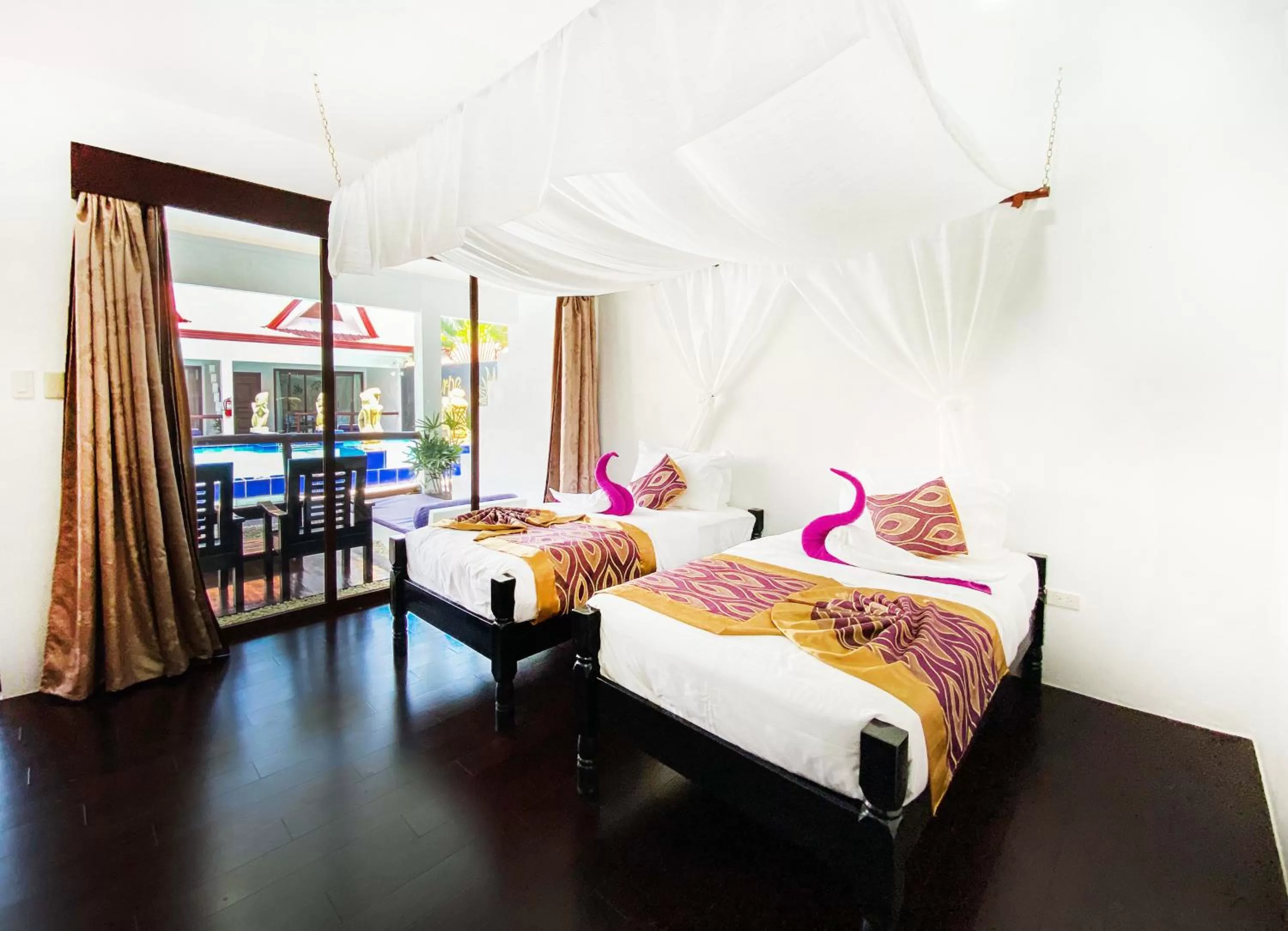 Bed in Carpe Diem Villas & Resort