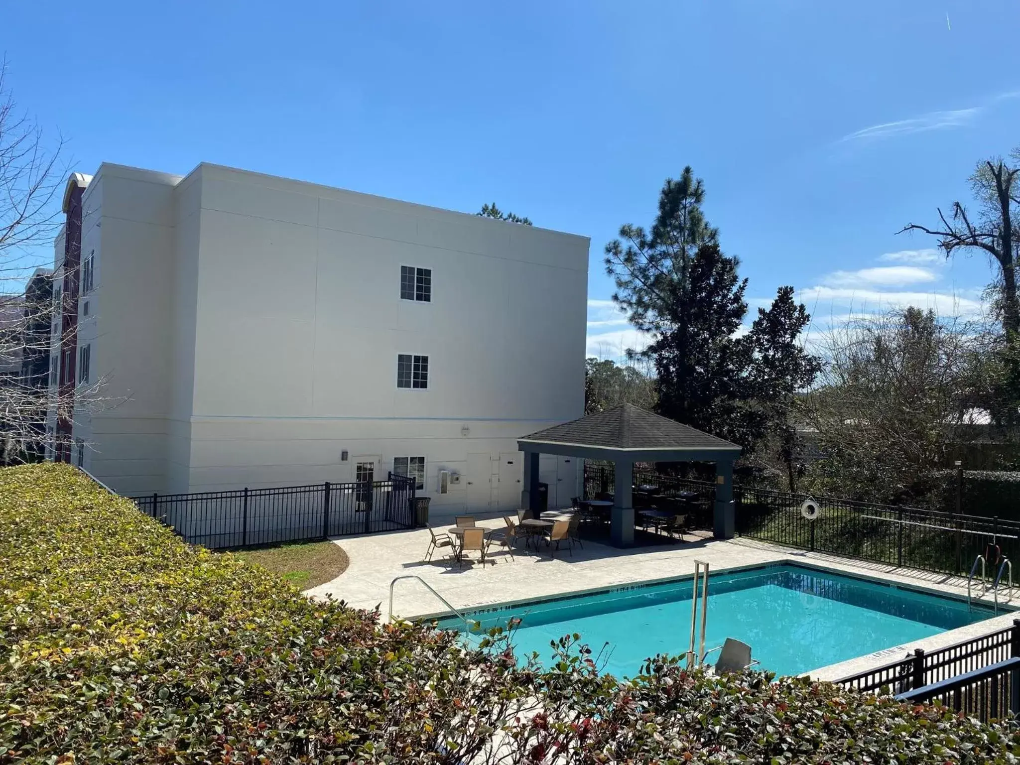 Swimming pool, Property Building in Candlewood Suites Tallahassee, an IHG Hotel