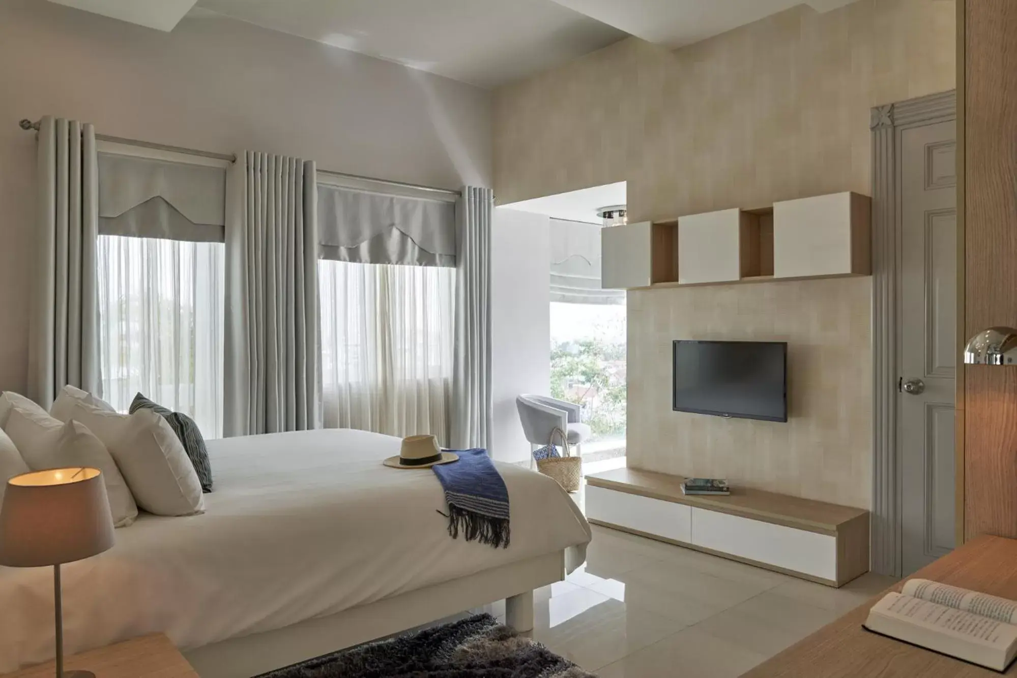 Bedroom, TV/Entertainment Center in The Wind Boutique Resort