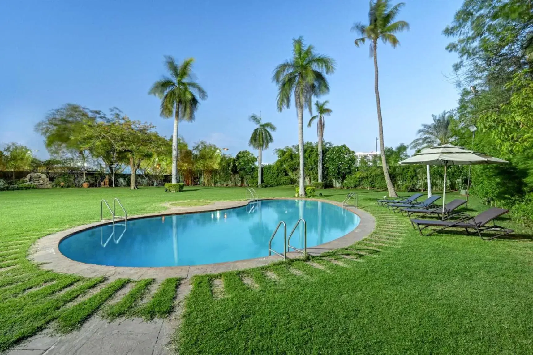Garden, Swimming Pool in The Cama - A Sabarmati Riverfront Hotel