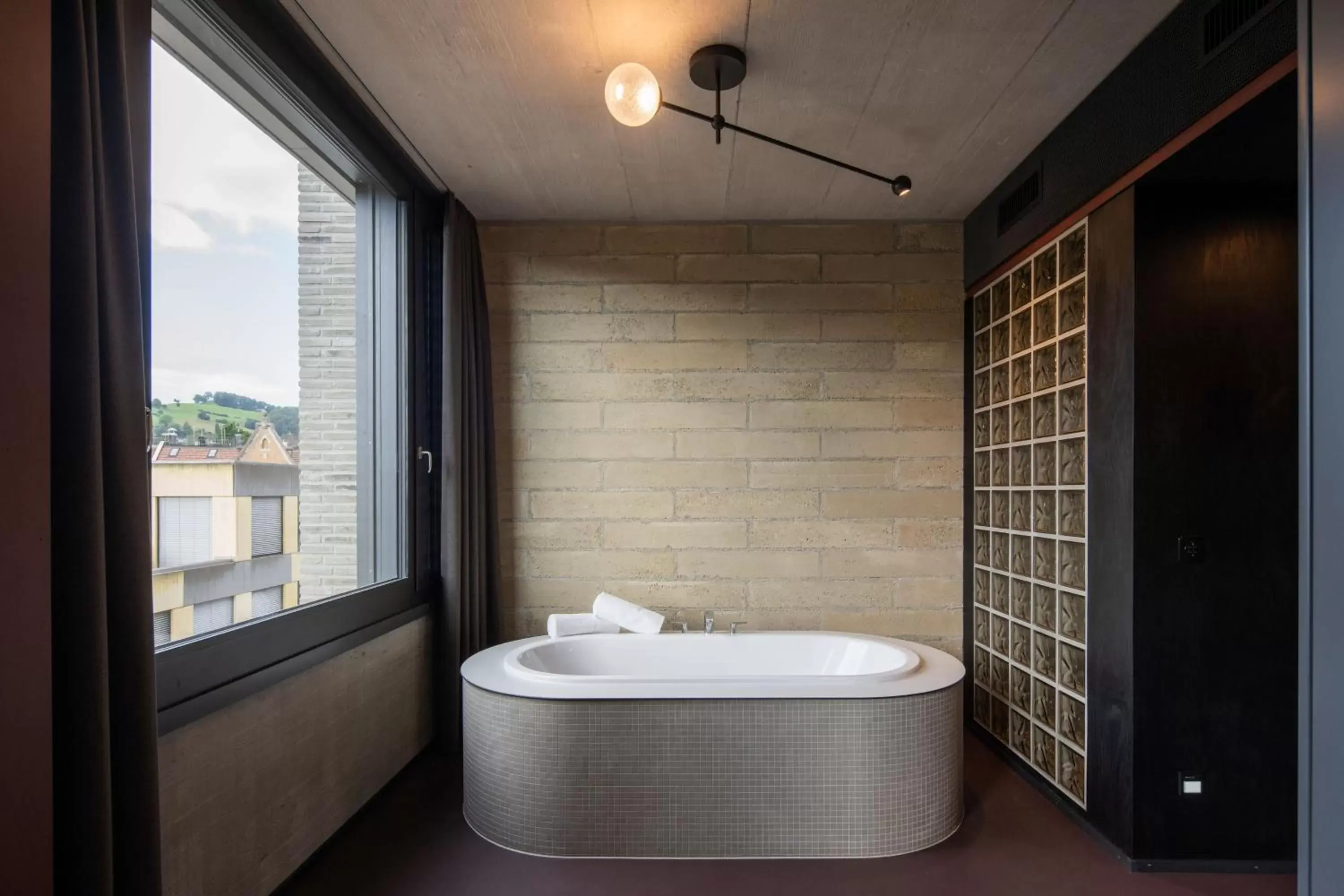 Bath, Bathroom in Tailormade Hotel LEO St Gallen