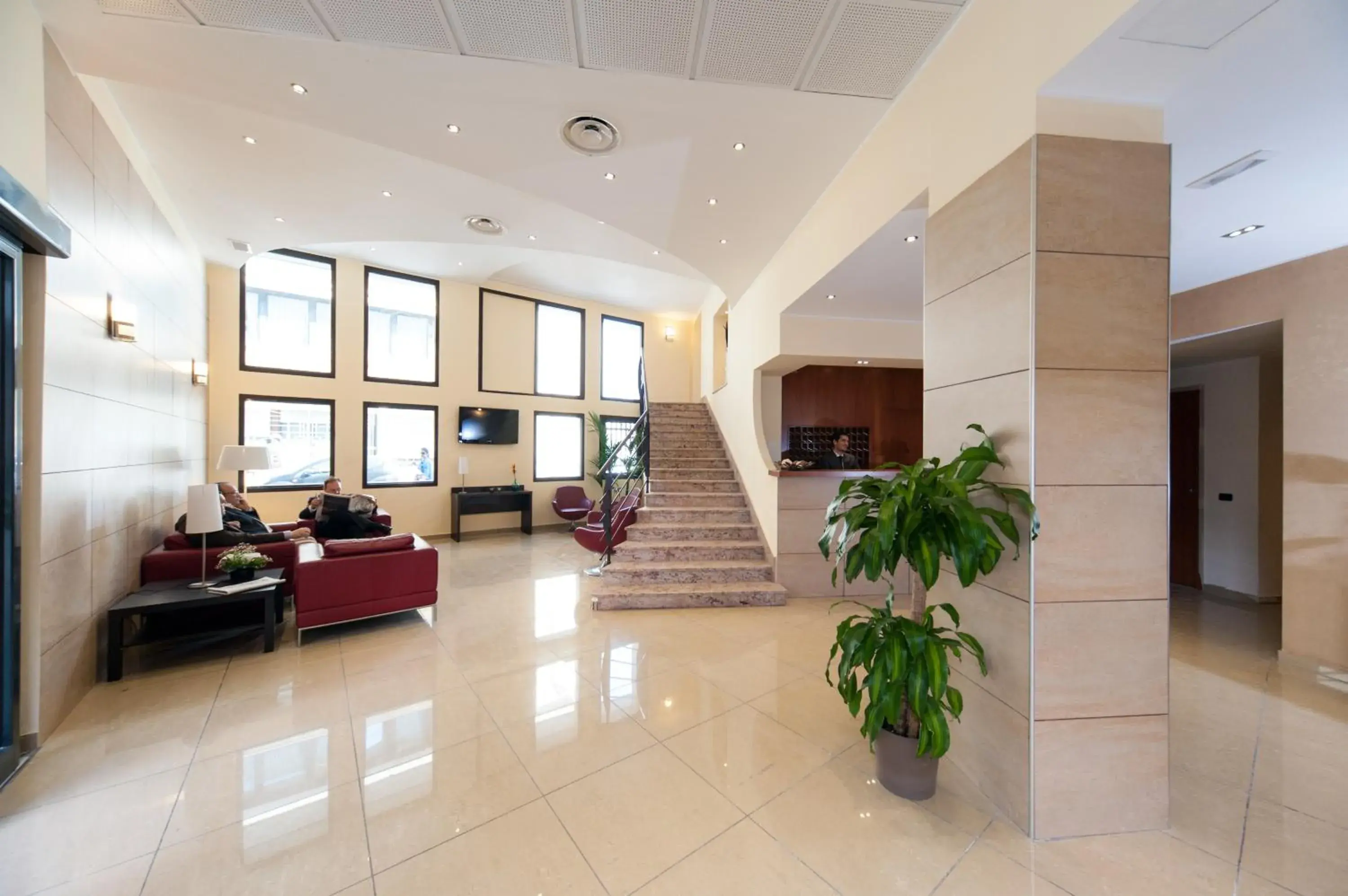 Communal lounge/ TV room, Lobby/Reception in Hotel Tiempo