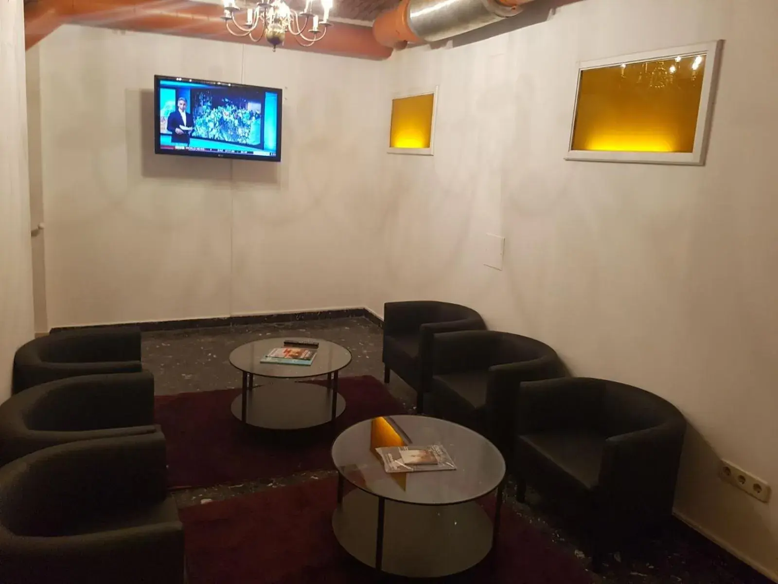 Communal lounge/ TV room, Seating Area in Hotel Carina