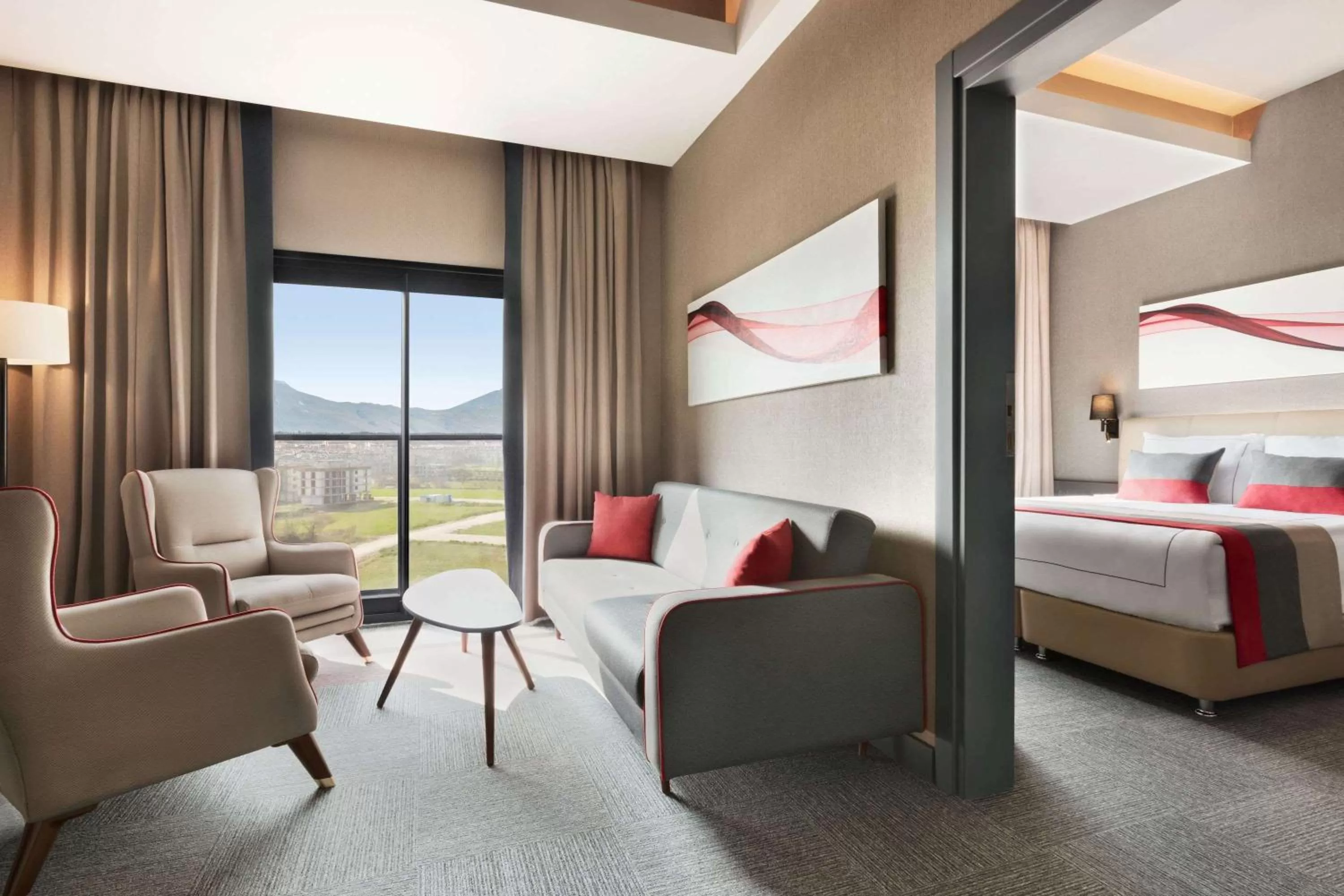 Living room, Bed in Ramada By Wyndham Tire