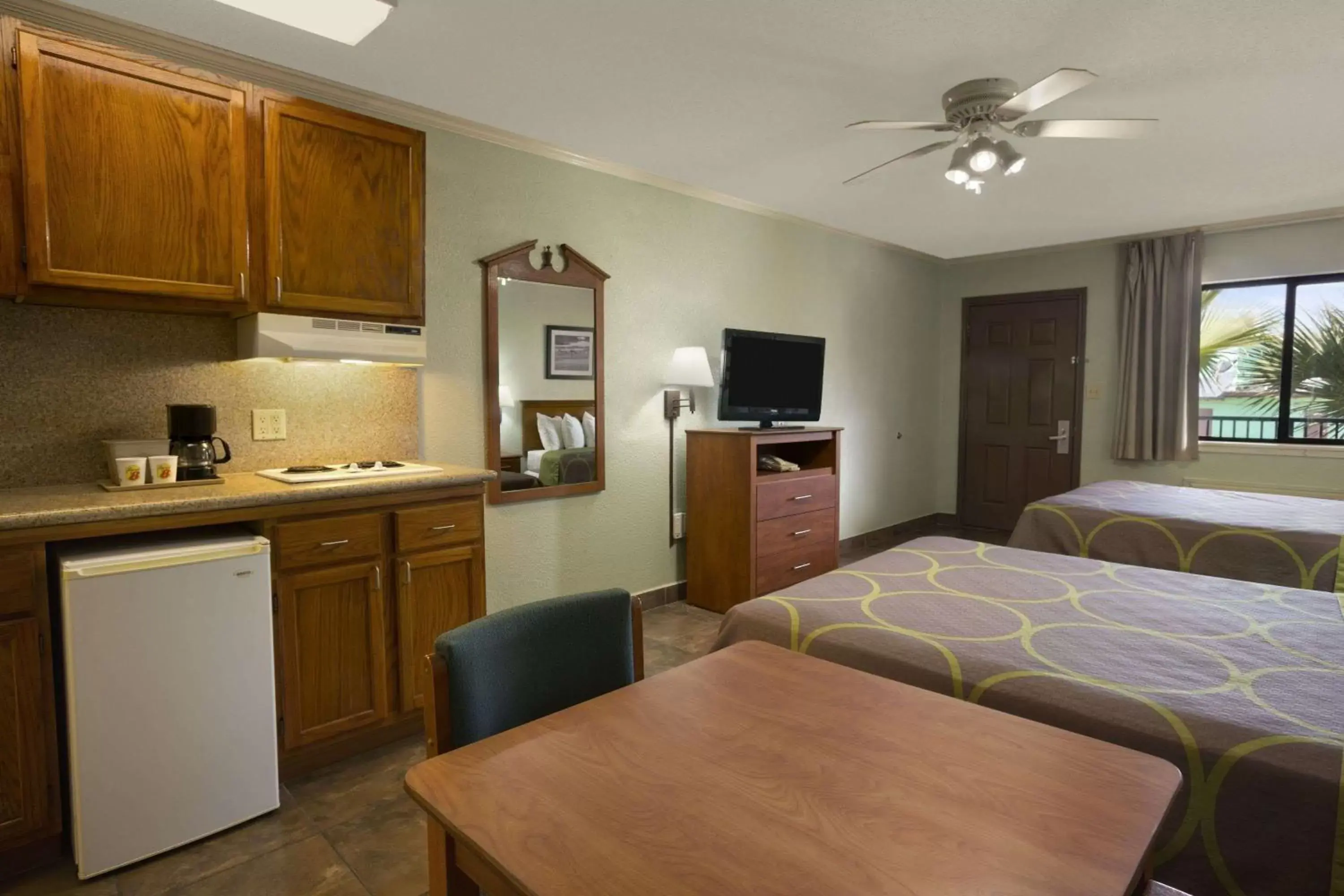 Photo of the whole room, Kitchen/Kitchenette in Super 8 by Wyndham South Padre Island