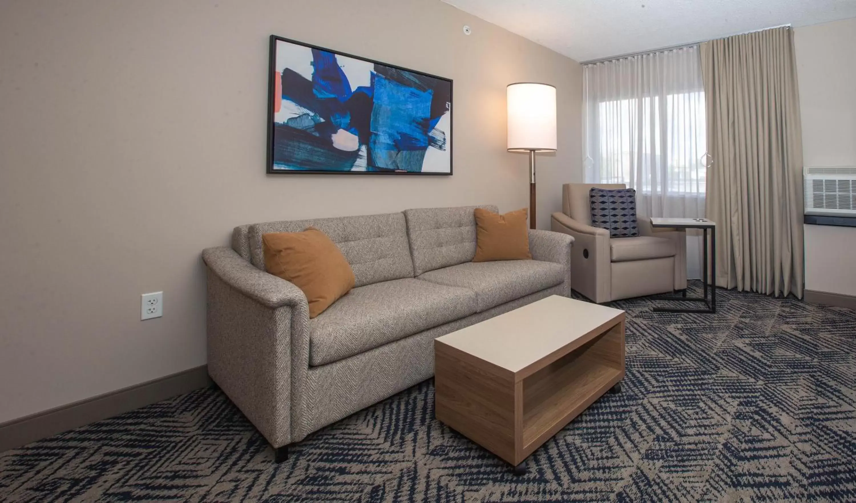 Living room, Seating Area in Candlewood Suites - Cleveland South - Independence, an IHG Hotel