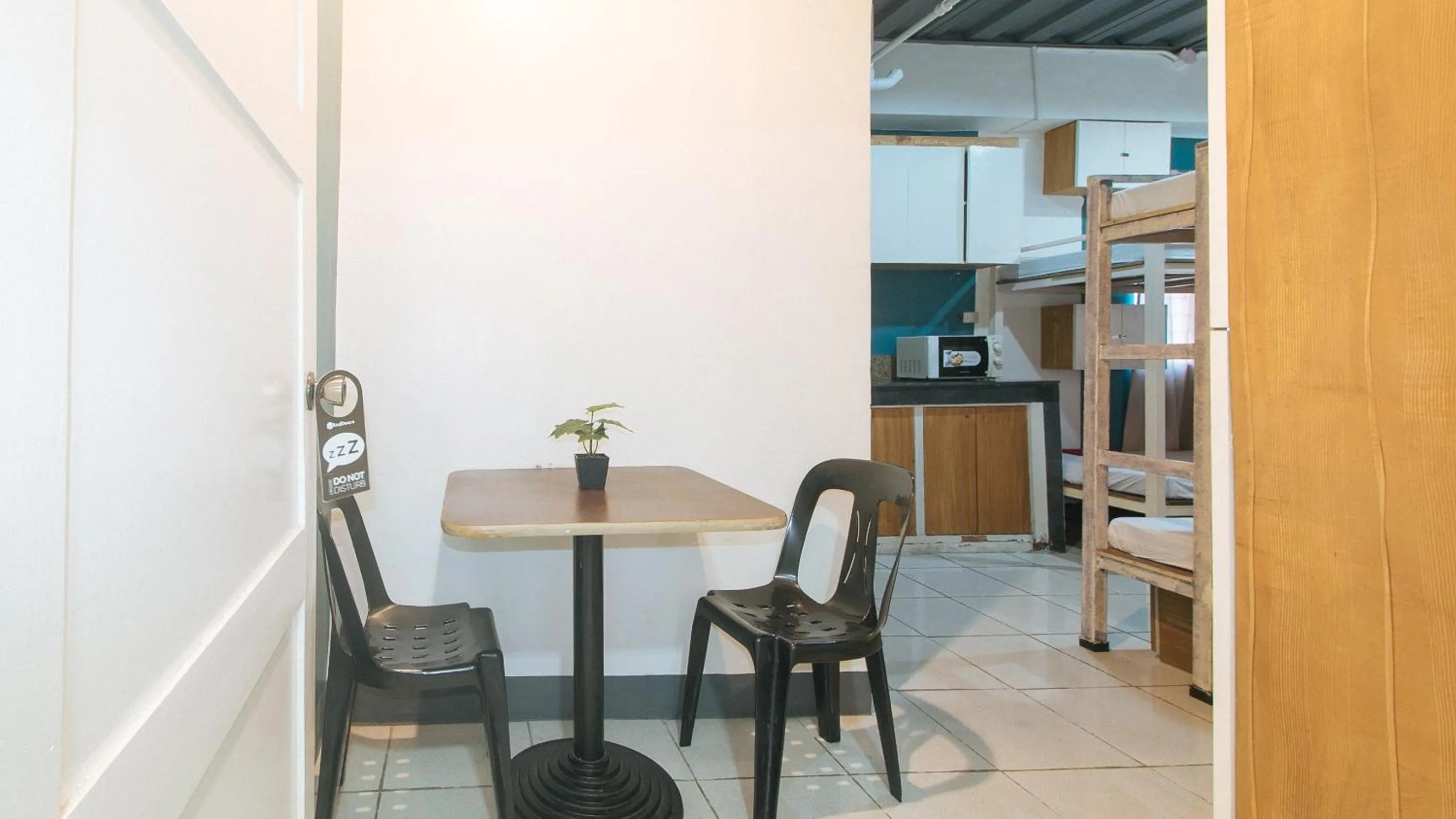 Seating area in RedDoorz at Crowne One Condo