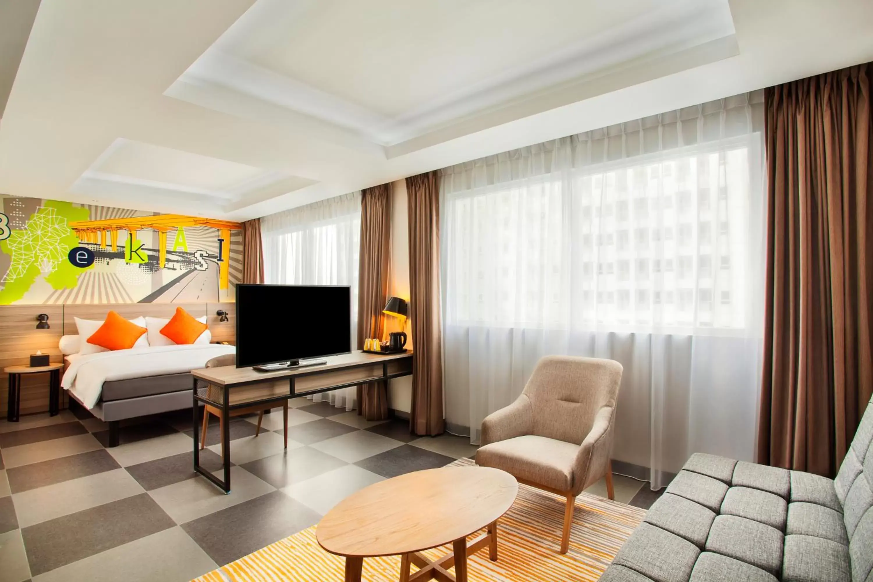 Bed, TV/Entertainment Center in ibis Styles Bekasi Jatibening