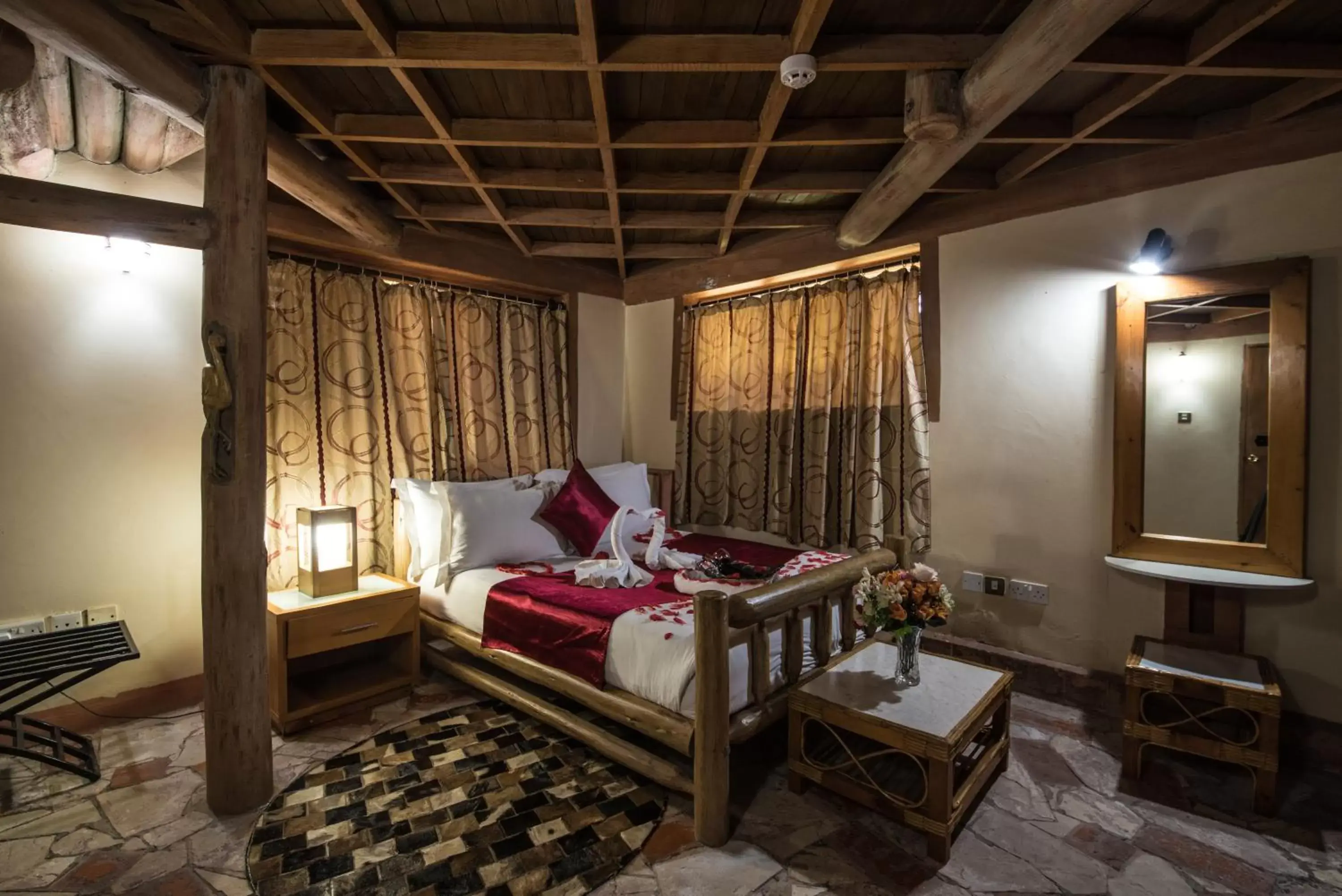 Bed, Seating Area in Forest Cottages