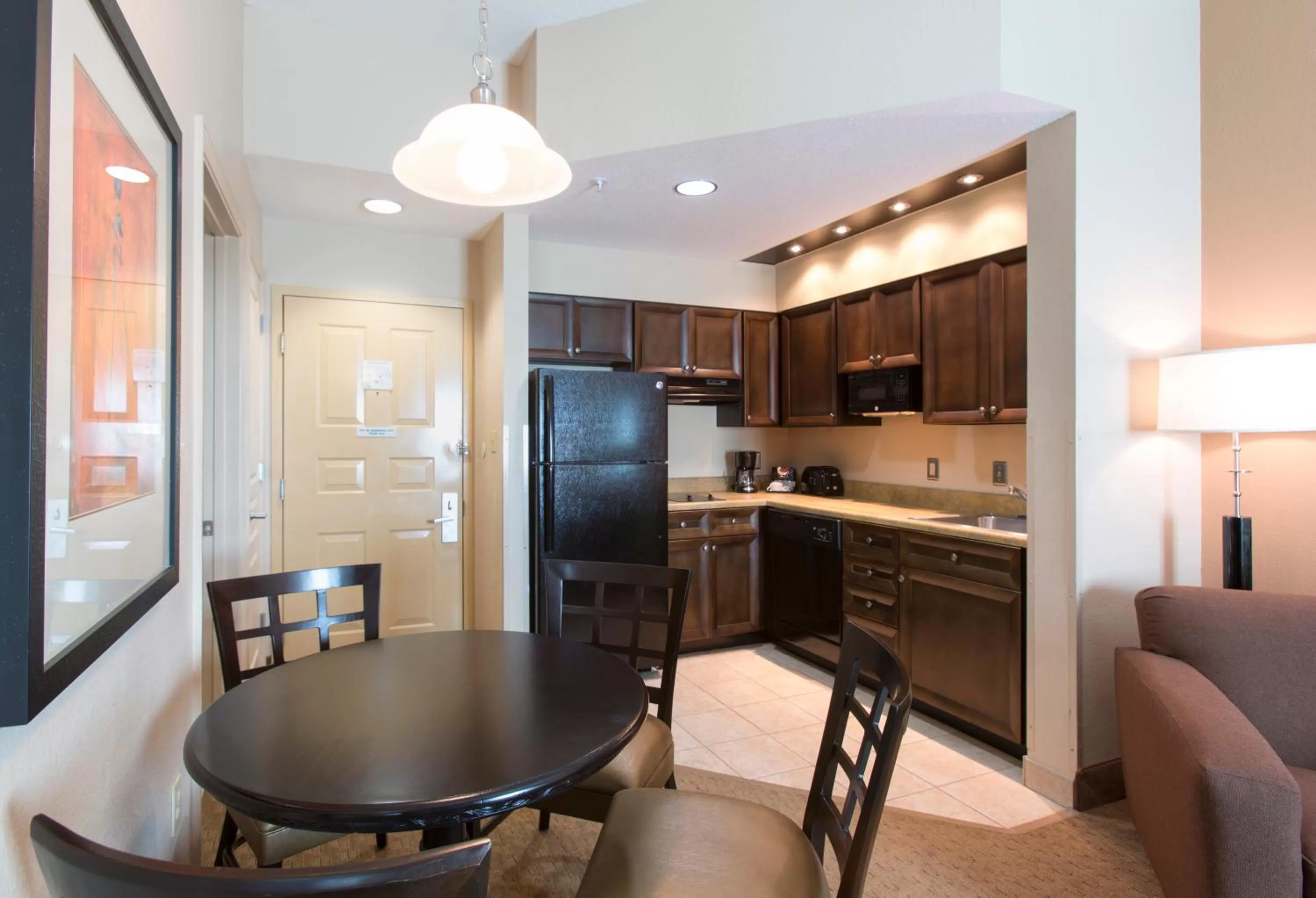 Kitchen or kitchenette in Hawthorn Extended Stay by Wyndham Orlando