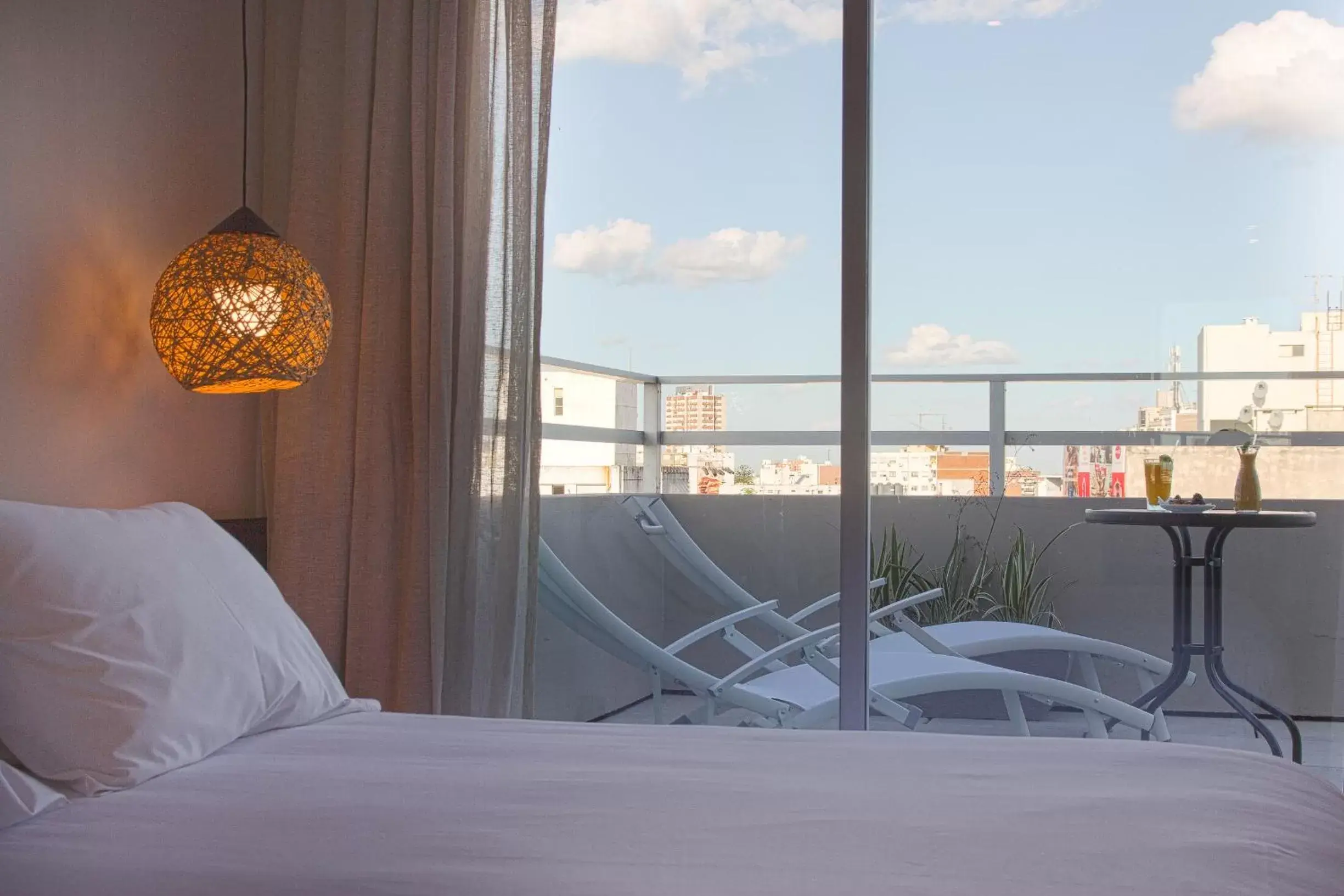 Balcony/Terrace, Bed in Hotel Ciudadano Suites