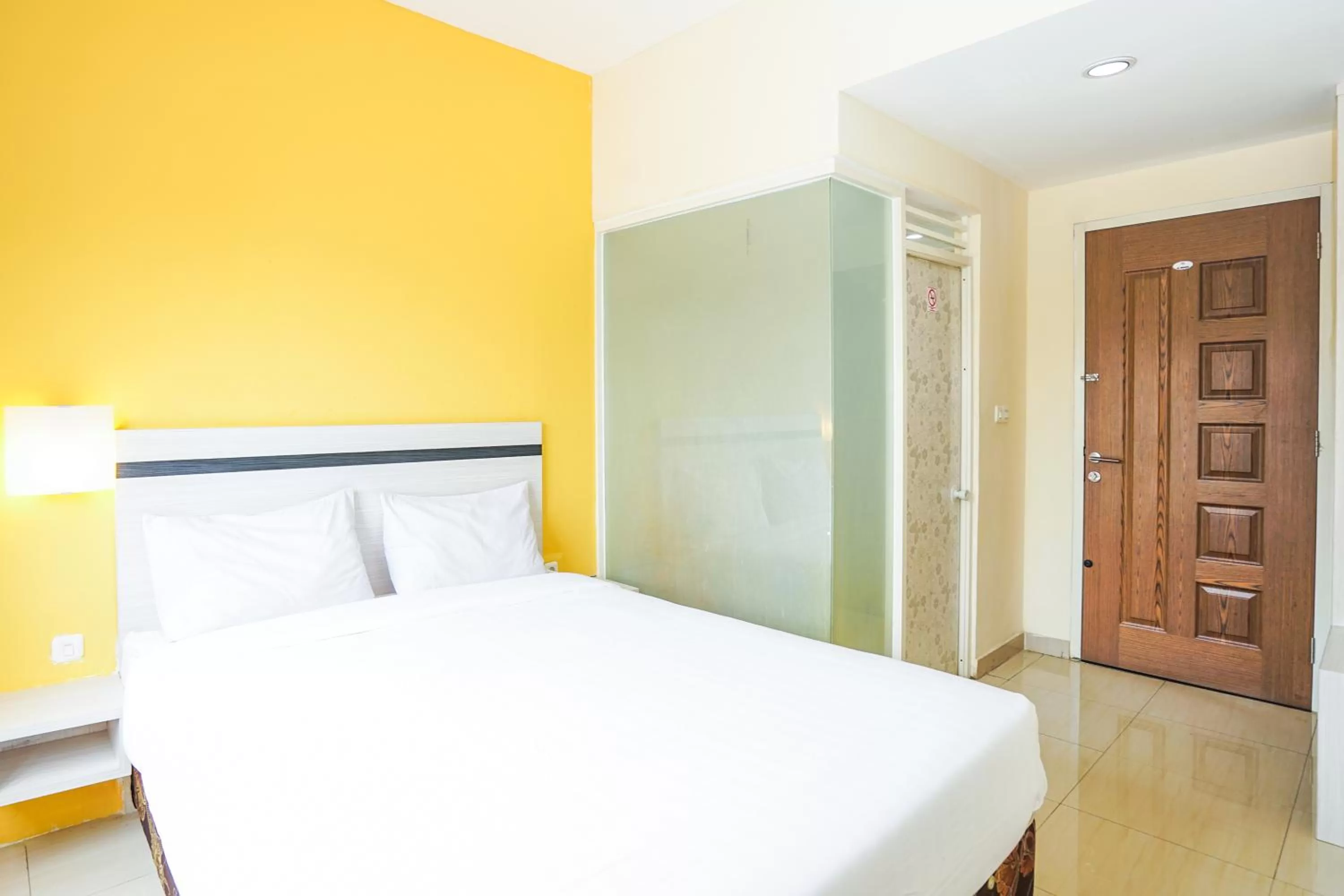 Bed in Pratisarawirya Guesthouse by ecommerceloka