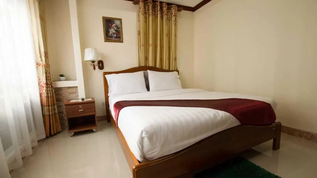 Bed in Bluebird Inn Pattaya