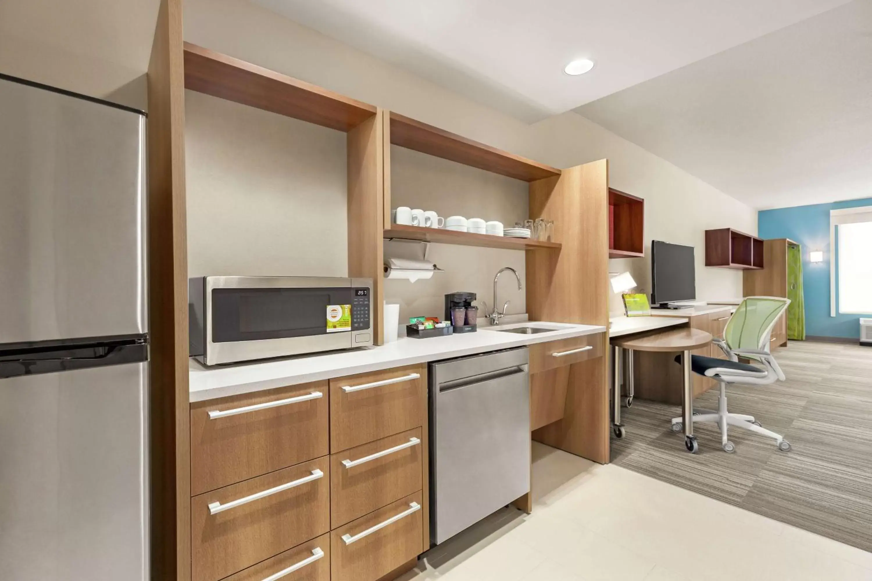 Bedroom, Kitchen/Kitchenette in Home2 Suites By Hilton Colorado Springs South, Co