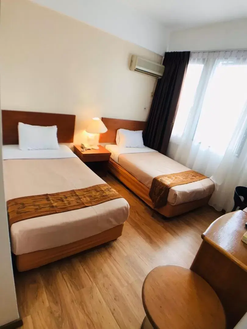 Bed in Kawan Hotel