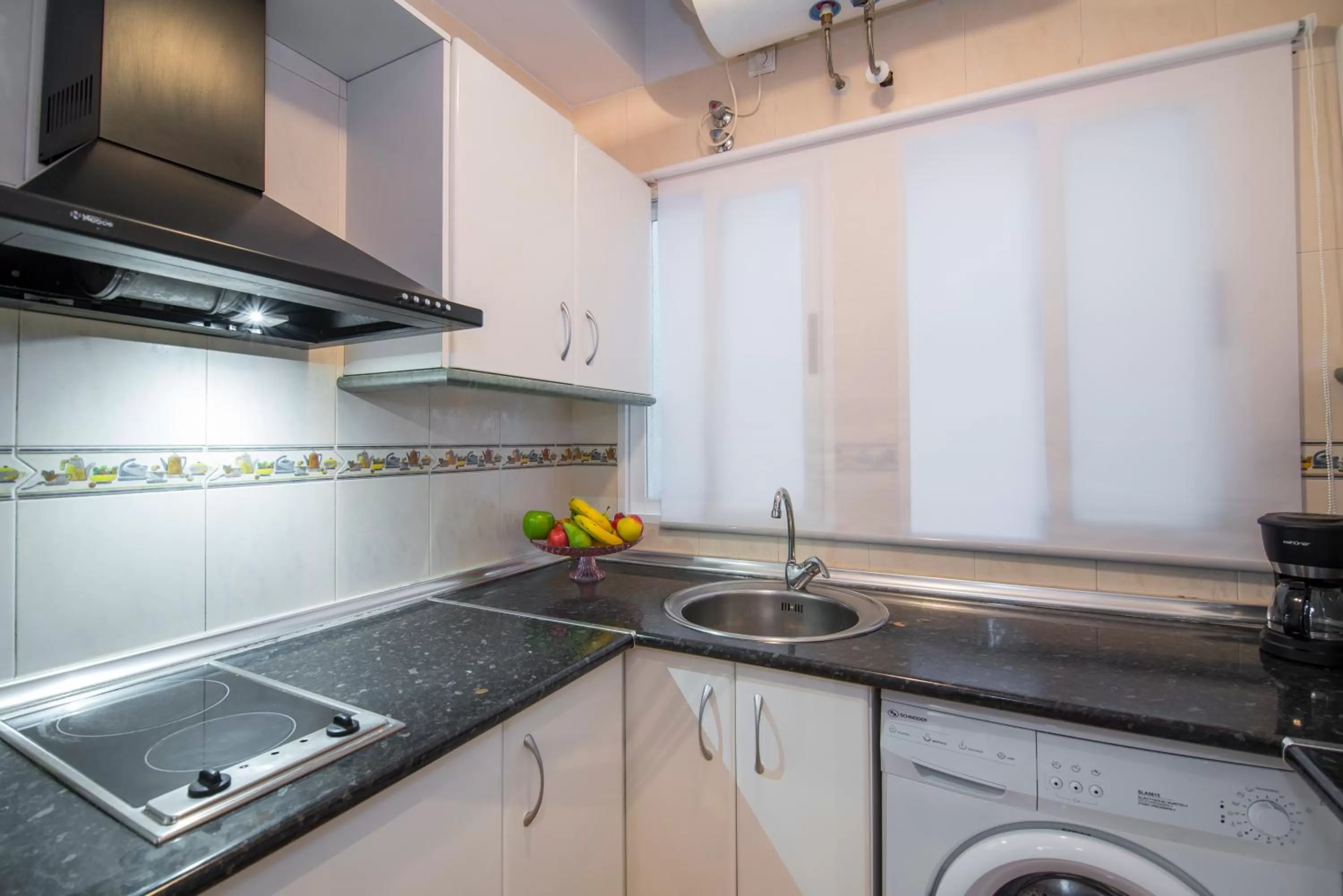 Kitchen or kitchenette in Apartamentos Granata