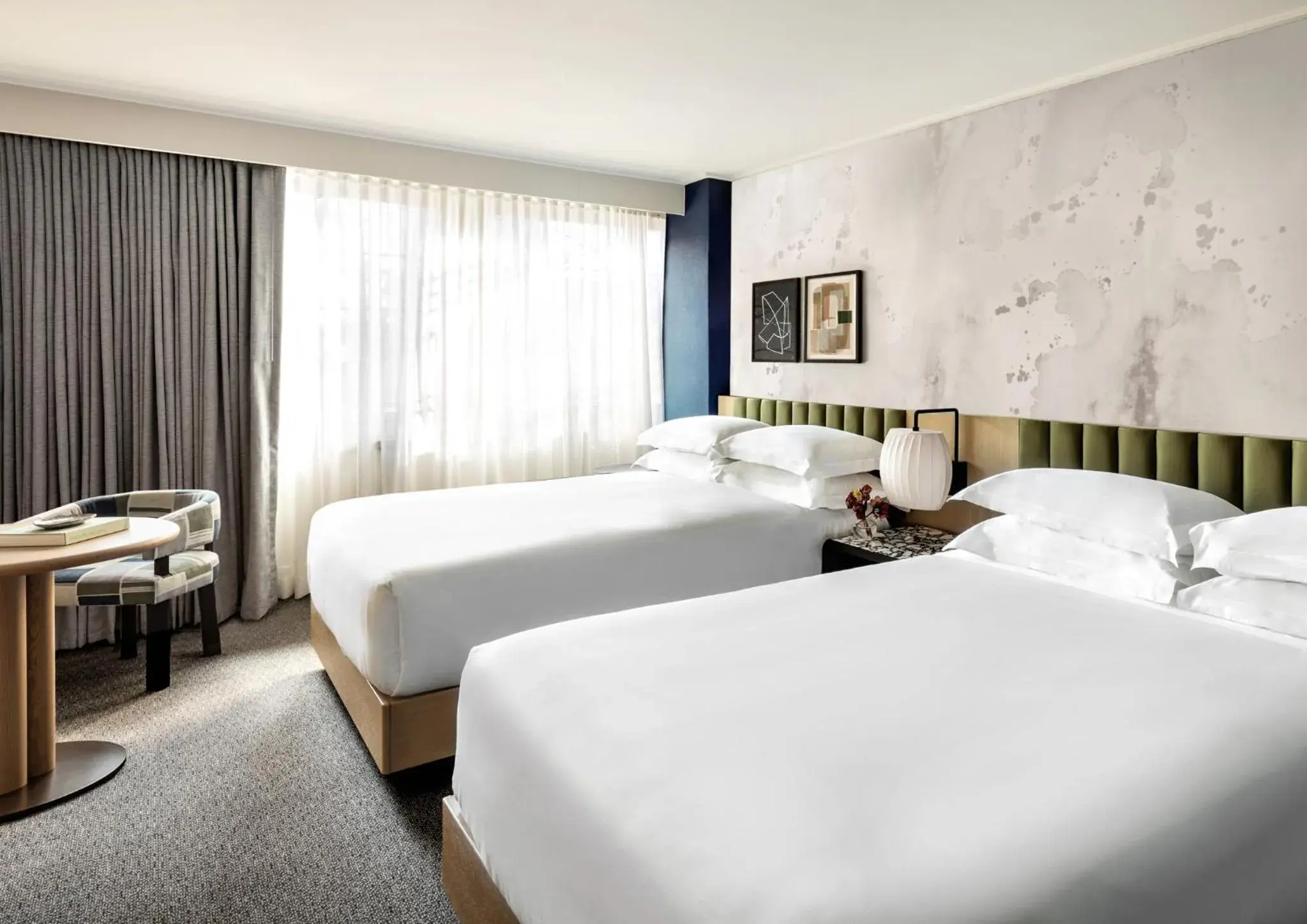 Bed in Kimpton Hotel Theta, an IHG Hotel