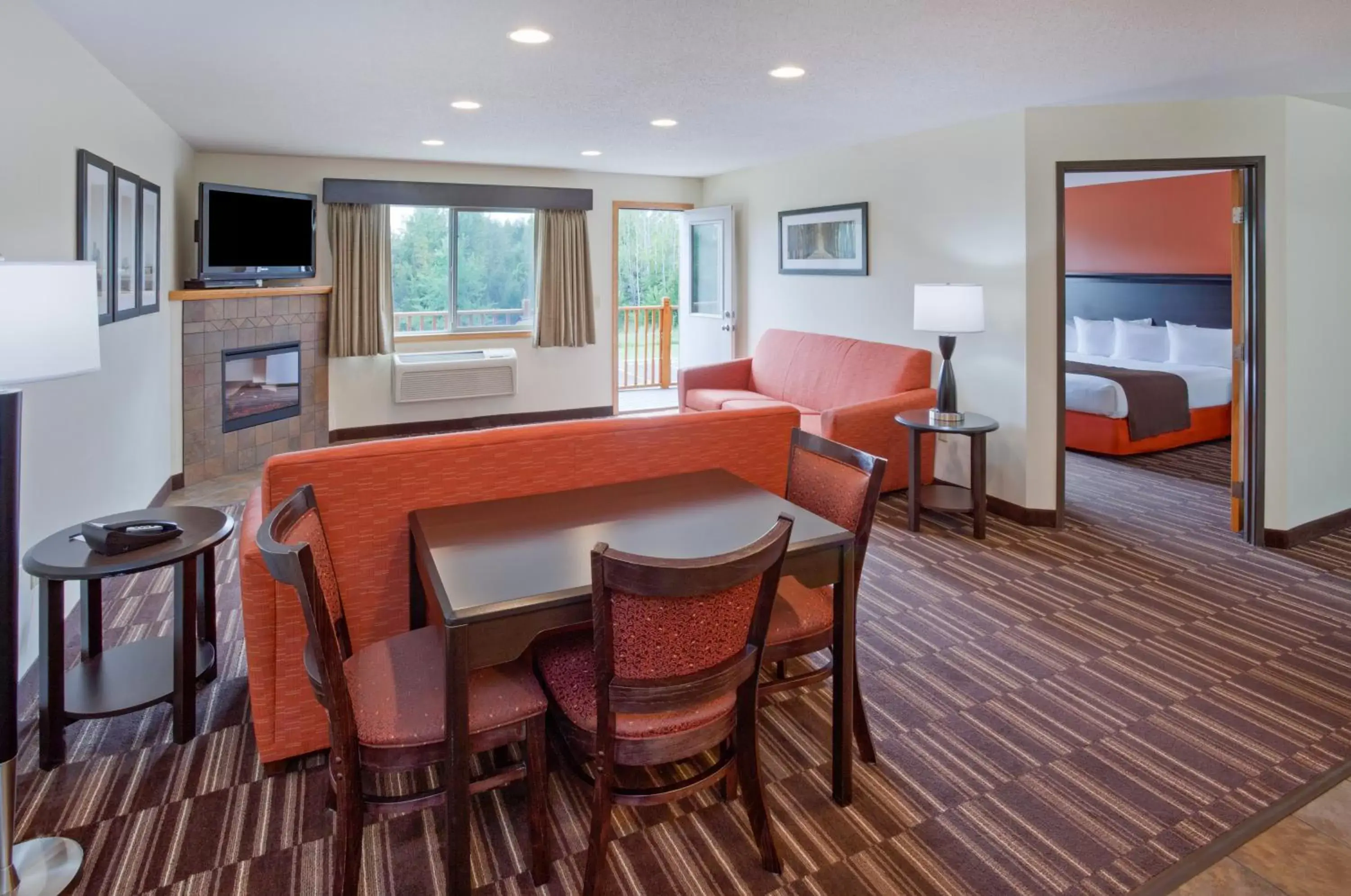 Living room, Dining Area in AmericInn by Wyndham Sartell