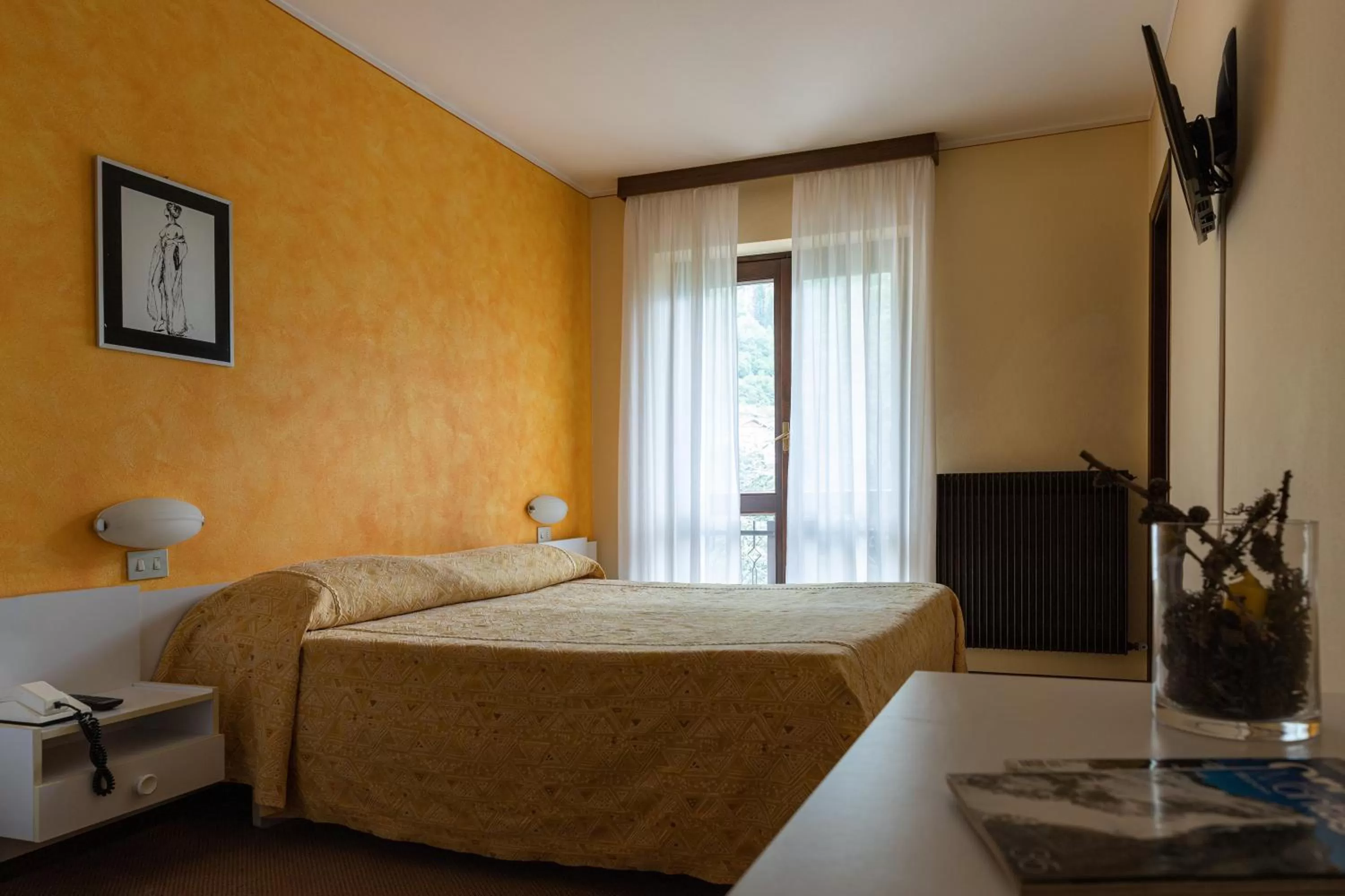 Bed in Meublè La Betulla