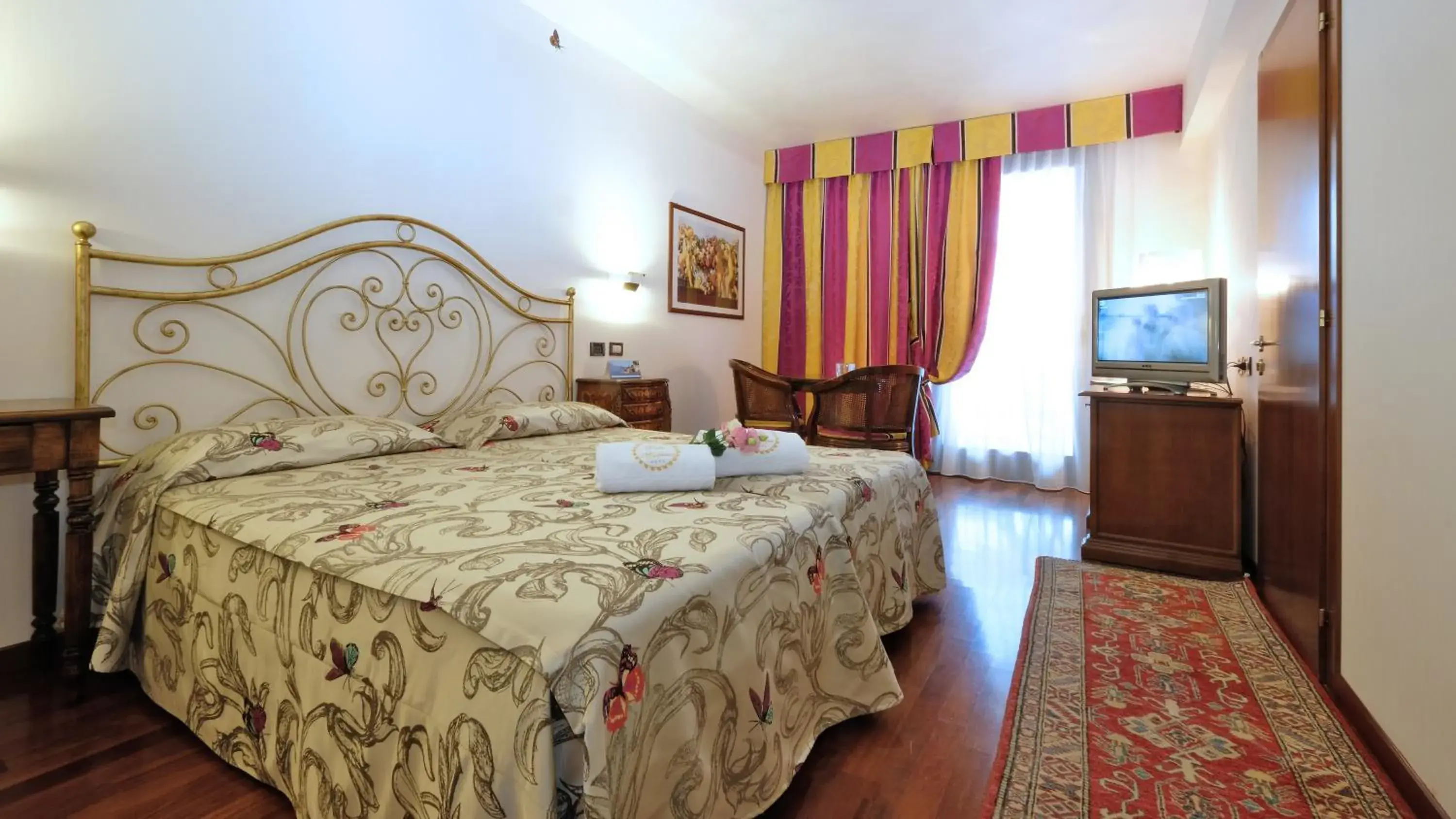 Bed in Villa Madrina Wellness Resort Hotel