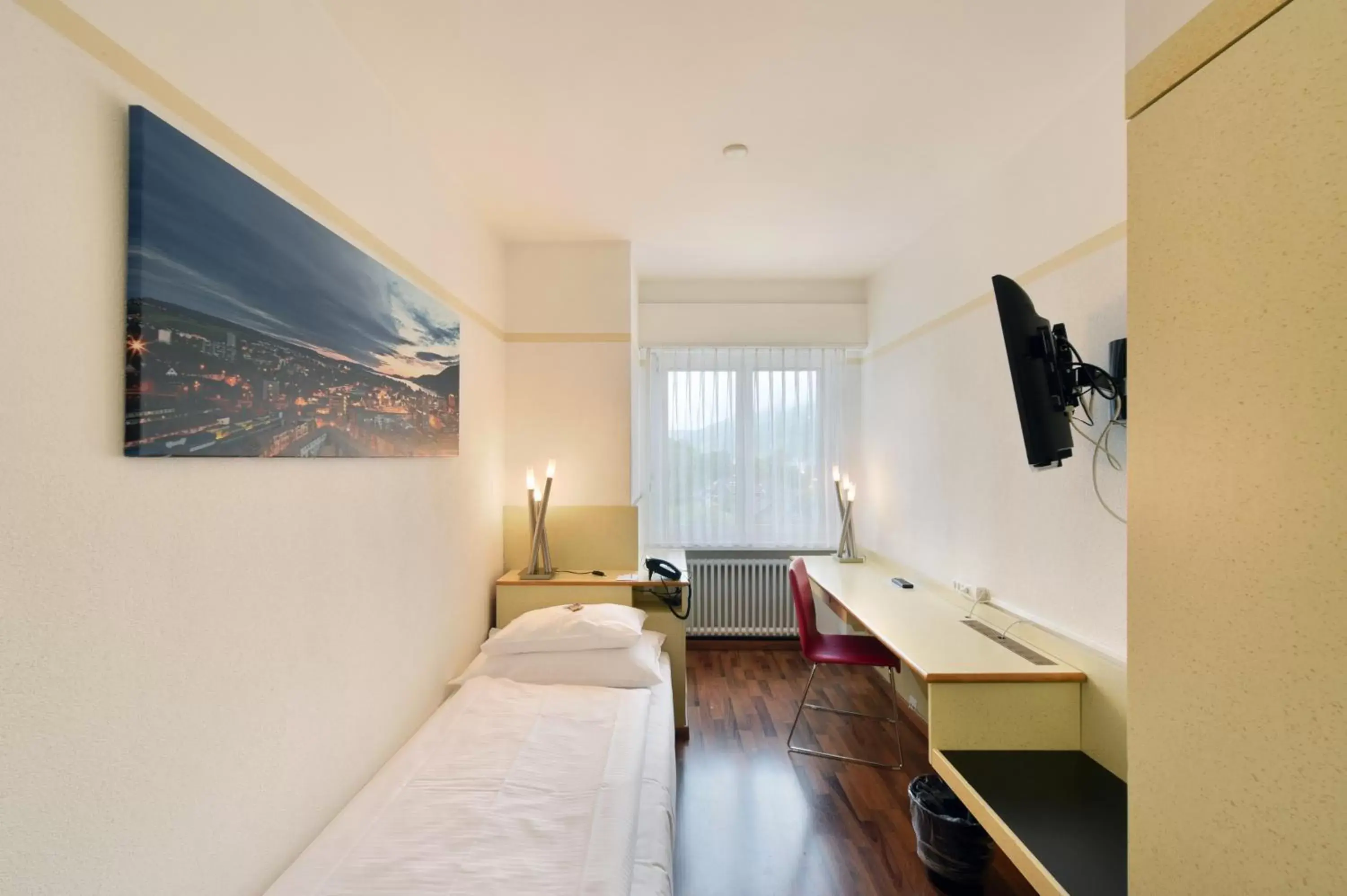 Photo of the whole room, TV/Entertainment Center in City Hotel Biel Bienne Free Parking