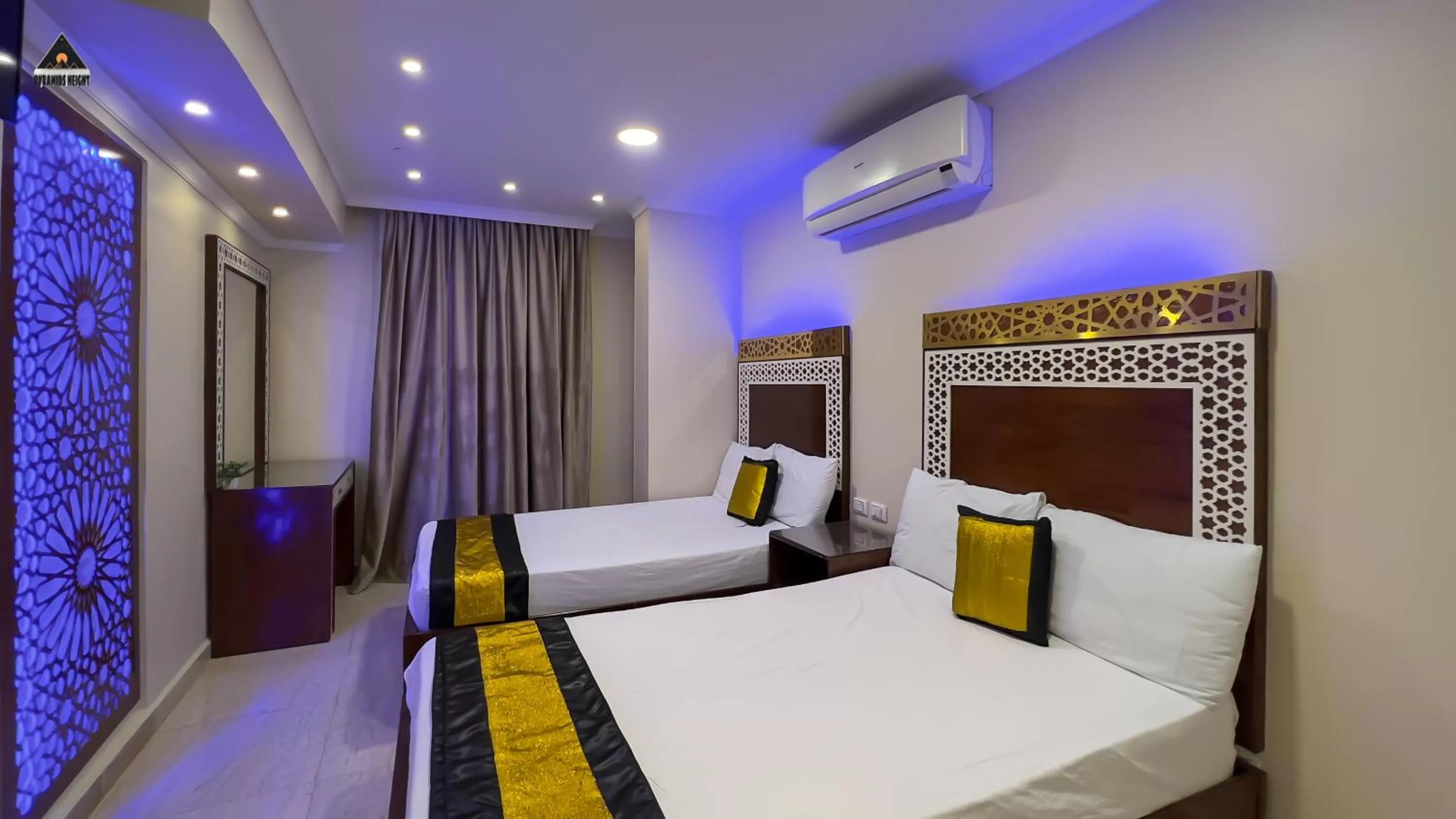 Bed in Pyramids Height Hotel & Pyramids Master Scene Rooftop