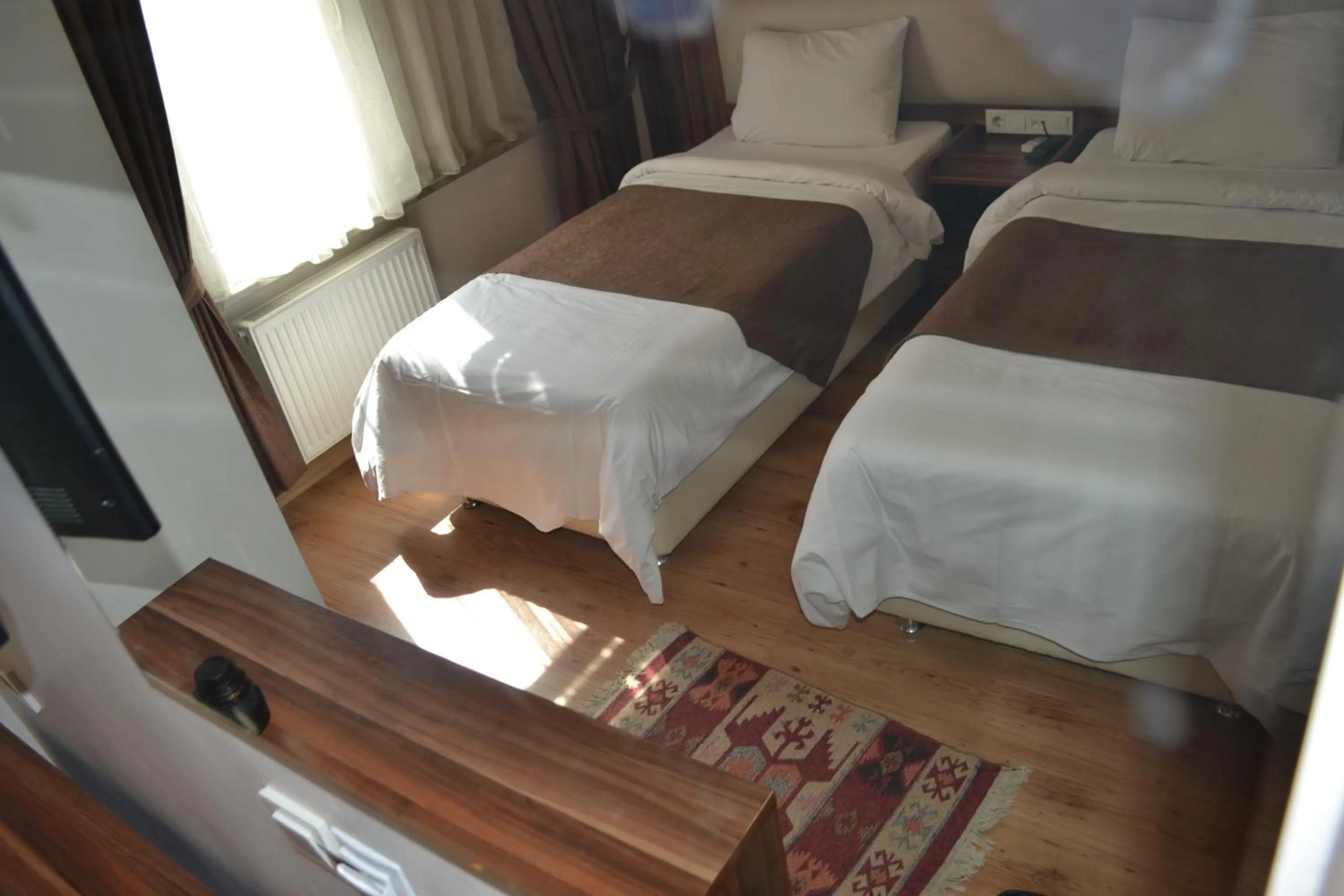 Seating area, Bed in New Fatih Hotel