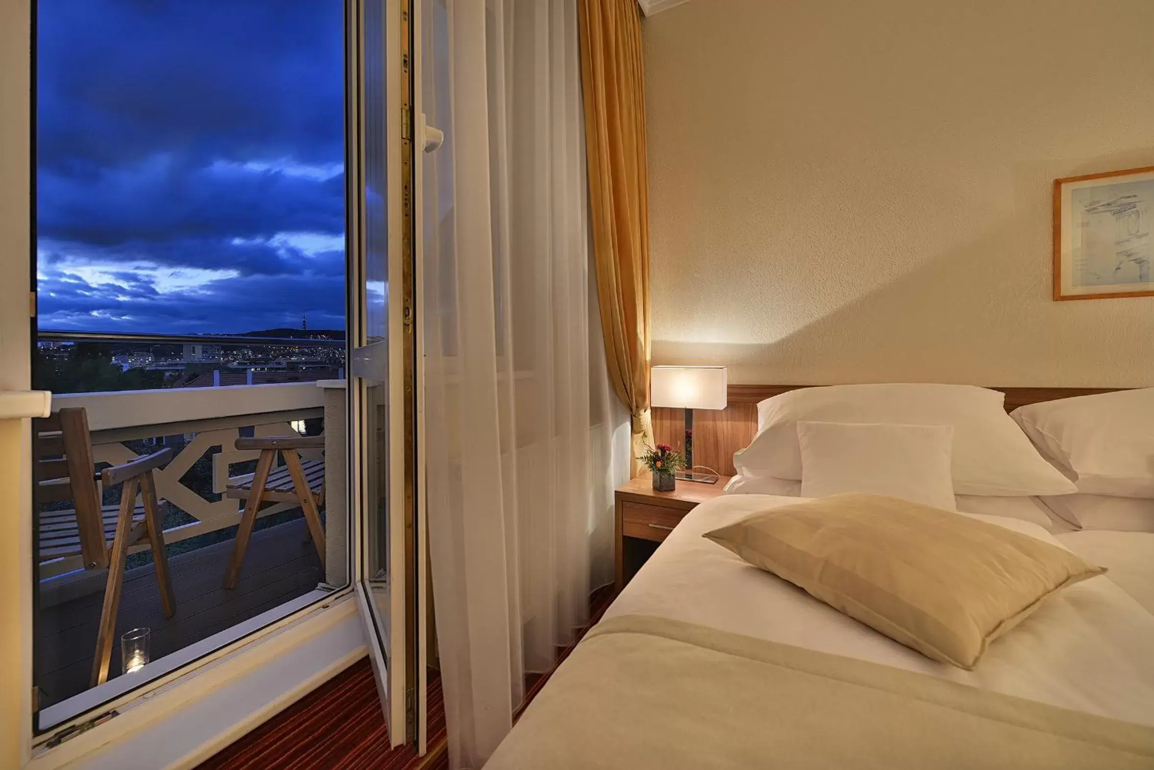 Balcony/Terrace, Bed in Apollo Hotel Bratislava