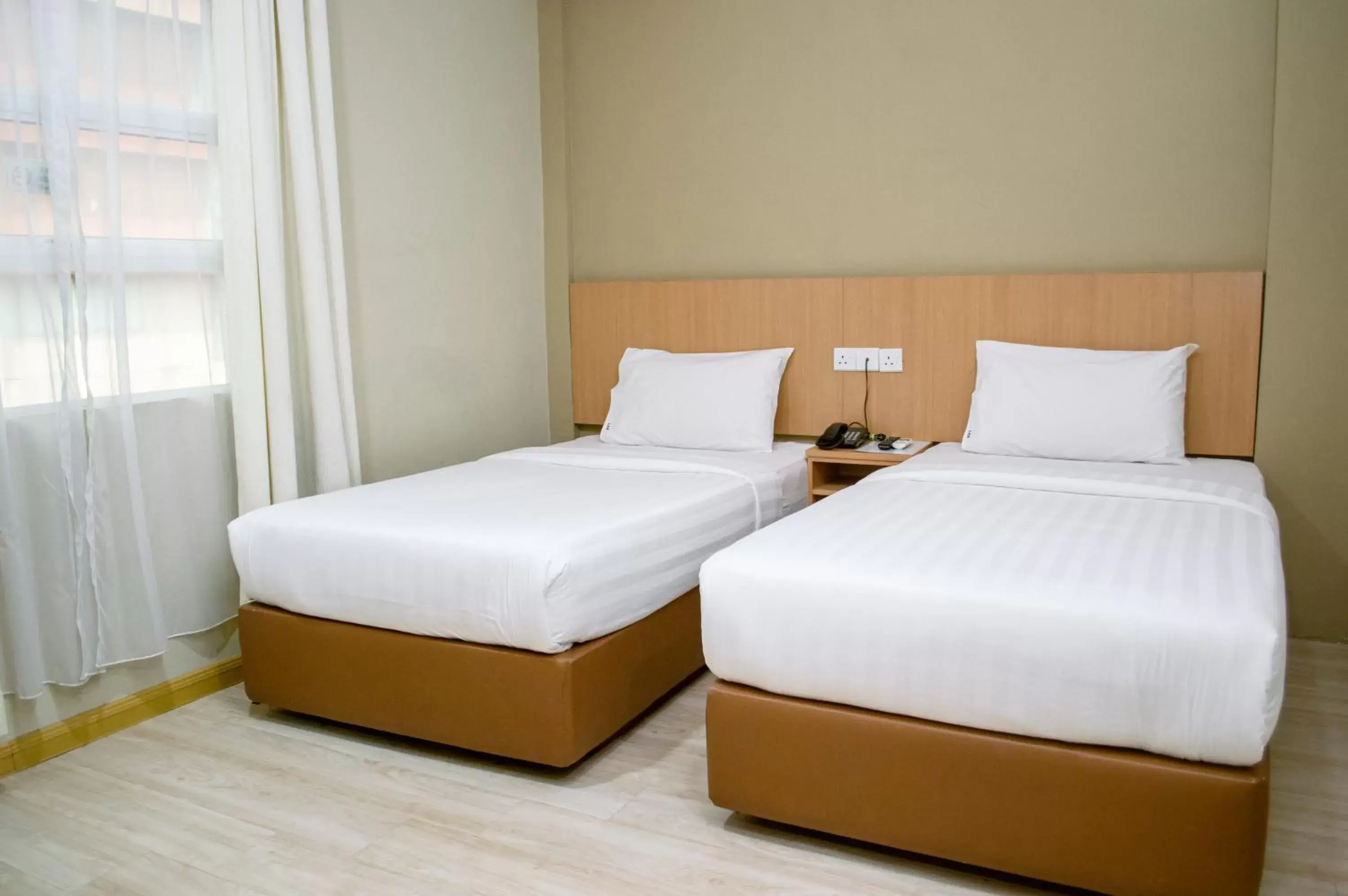 Bed in Labuan Avenue Hotel