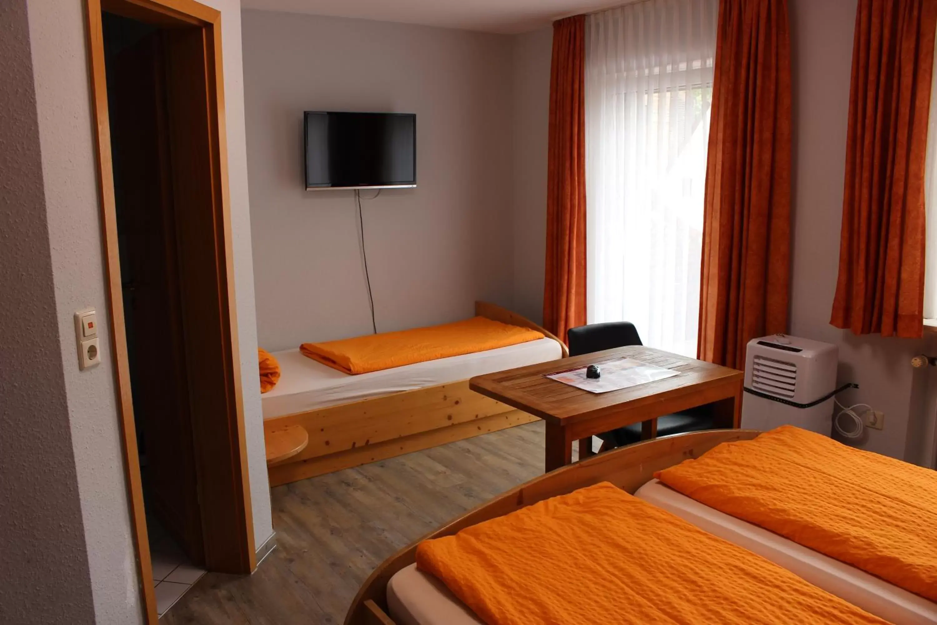 Bedroom, TV/Entertainment Center in Hotel Rheintal