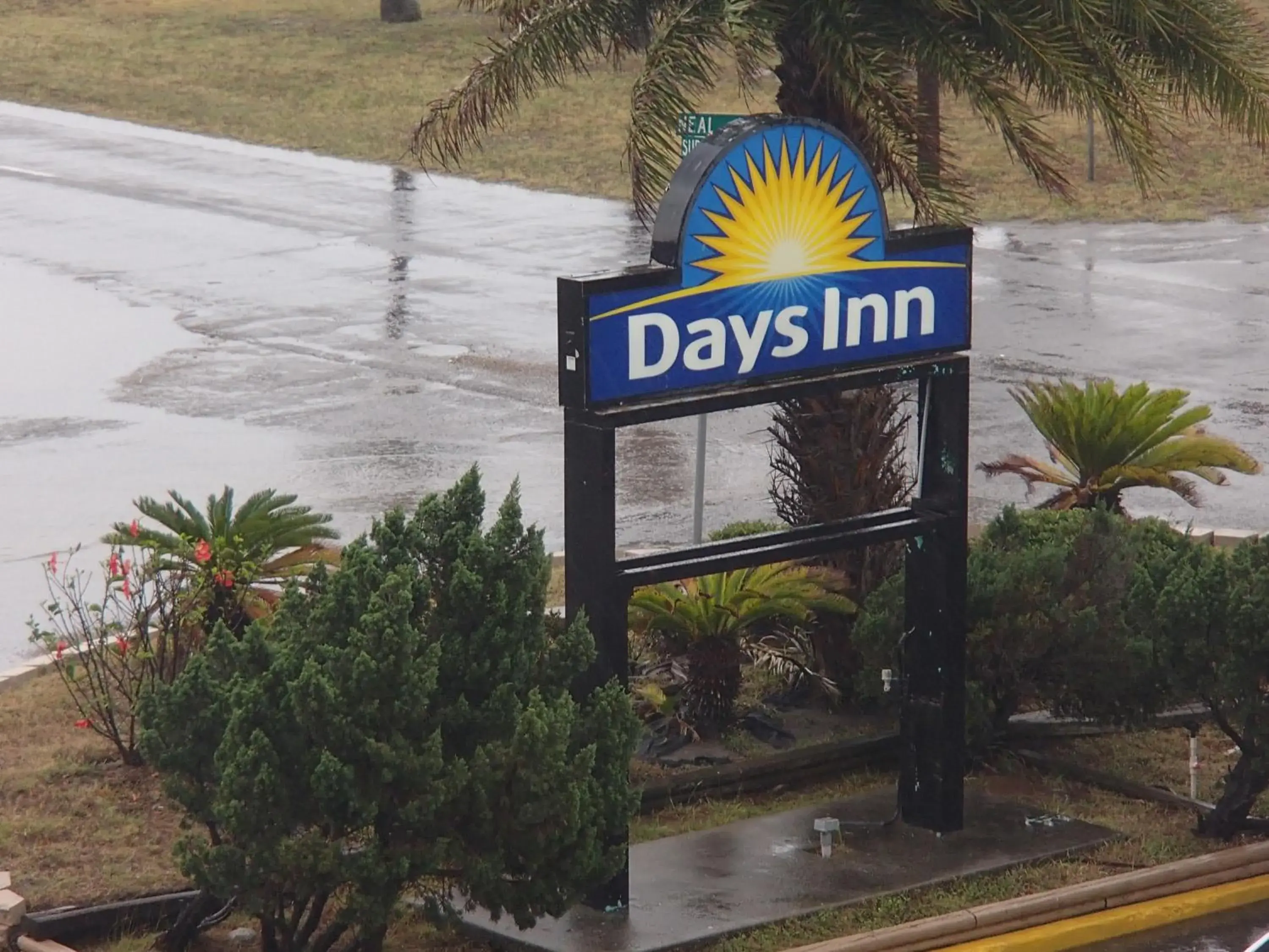 Property logo or sign in Days Inn by Wyndham Corpus Christi Beach