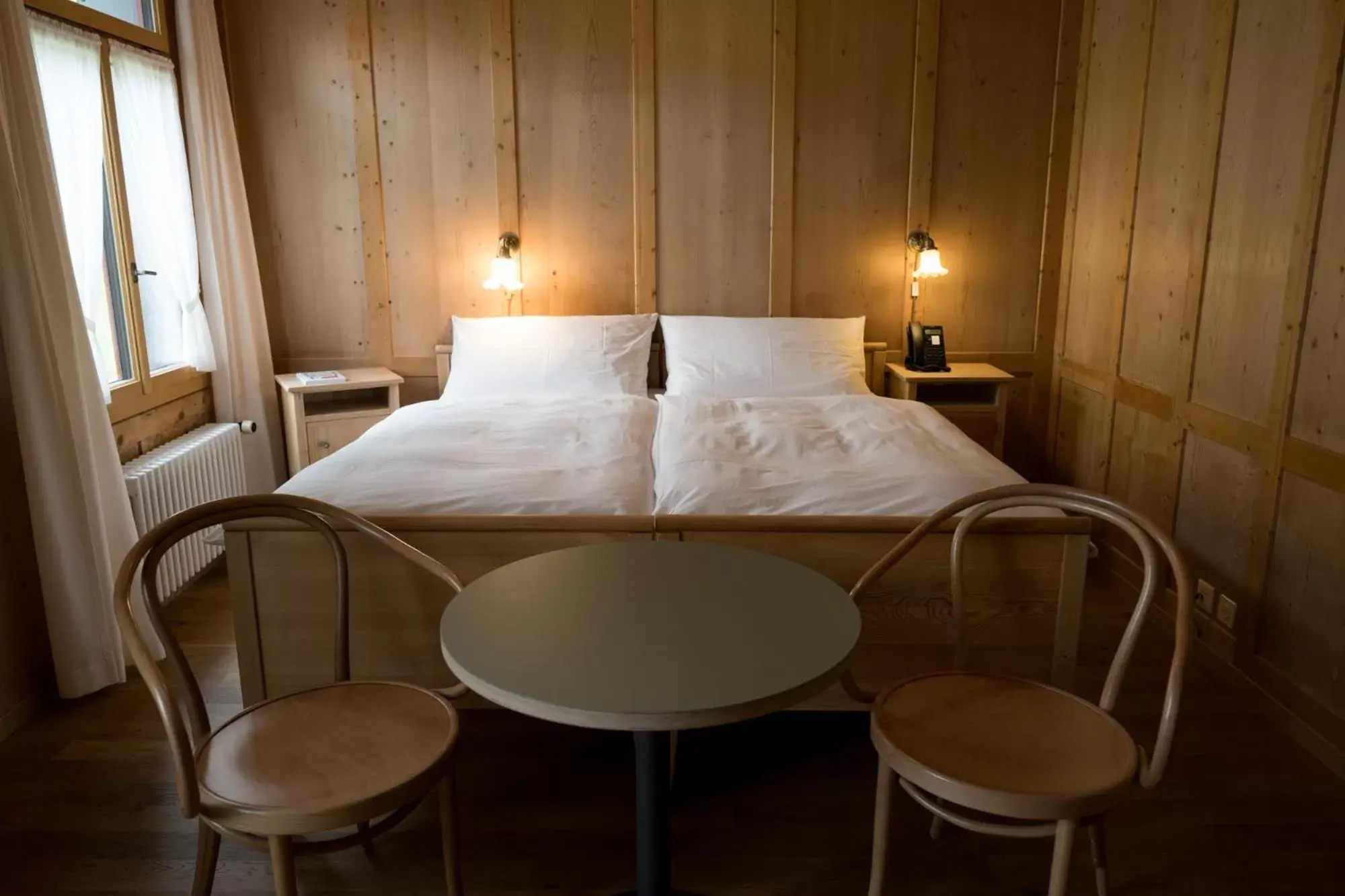 Photo of the whole room, Bed in FLÜHLI Hotel Kurhaus