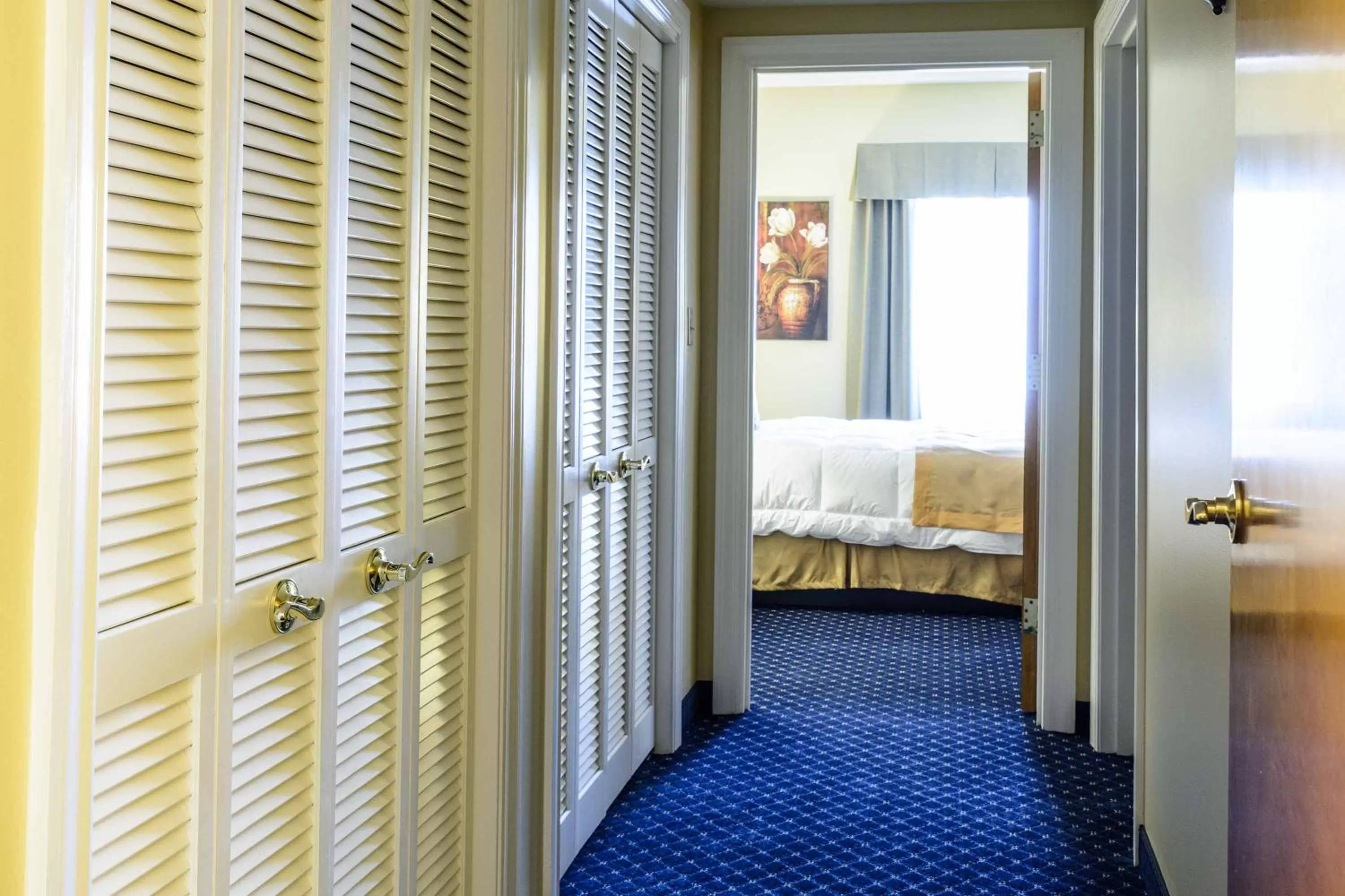 Bed in Asbury Inn & Suites