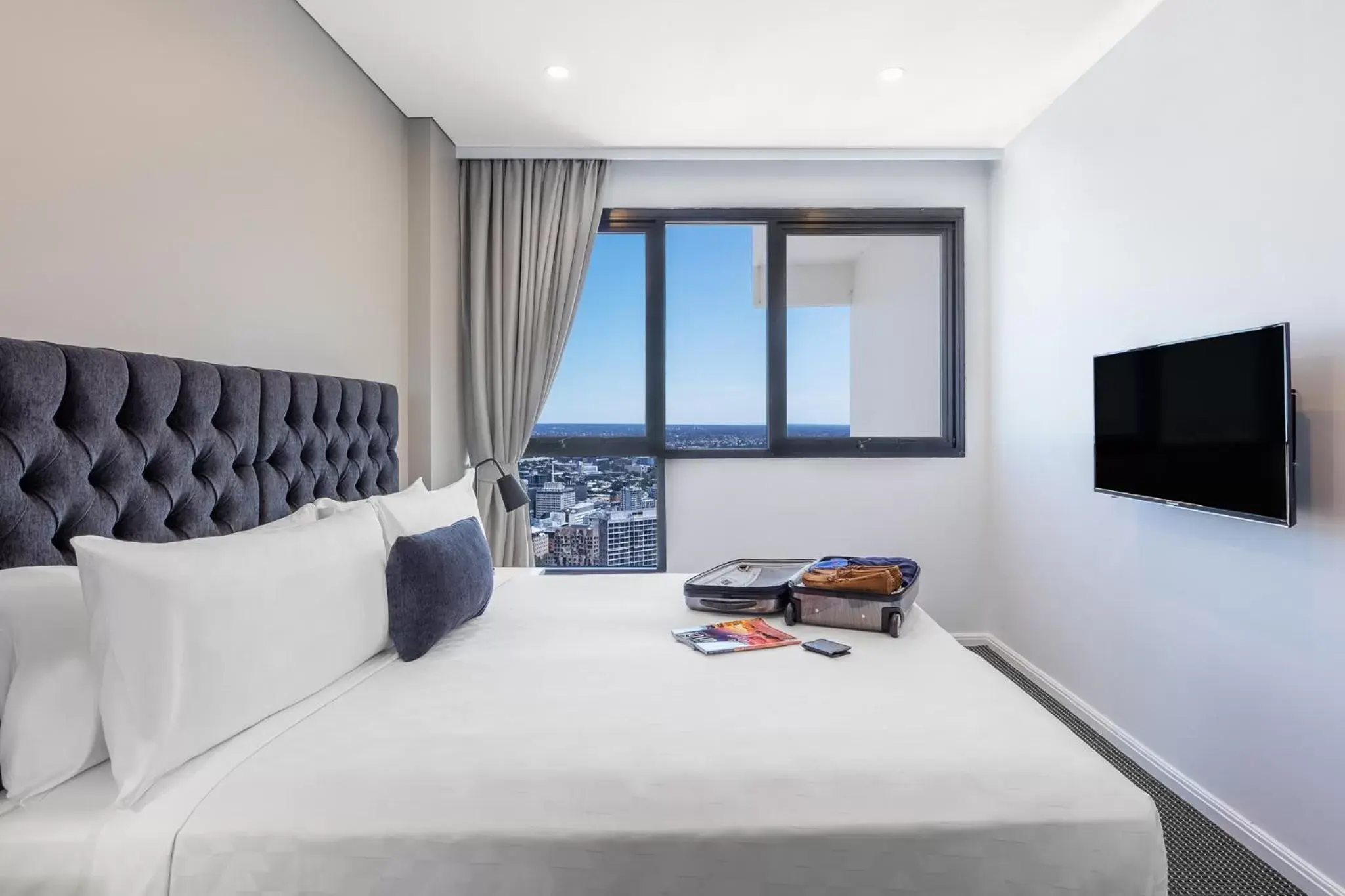 Bed in Meriton Suites Kent Street, Sydney