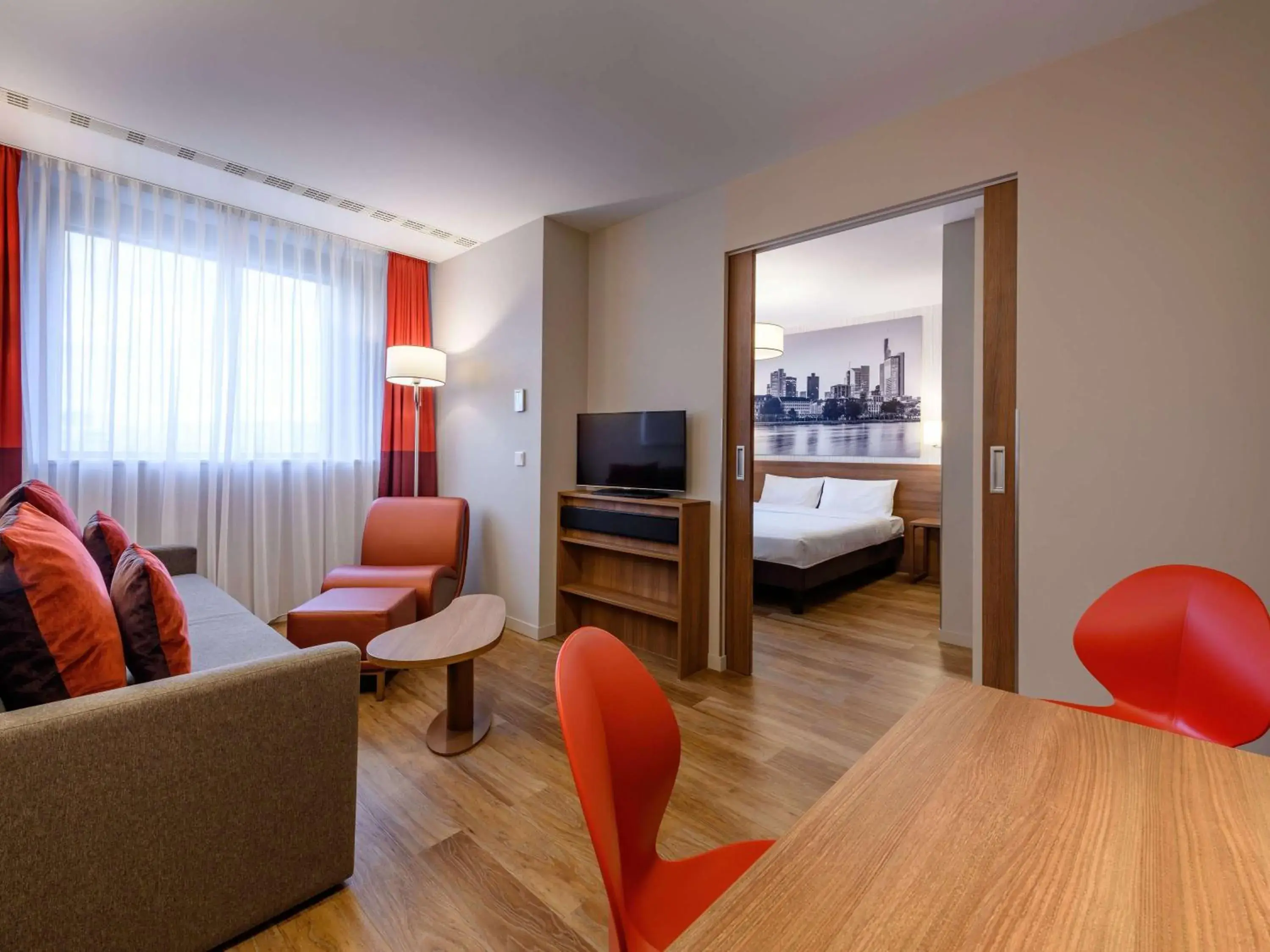 Bedroom, Seating Area in Aparthotel Adagio Frankfurt City Messe