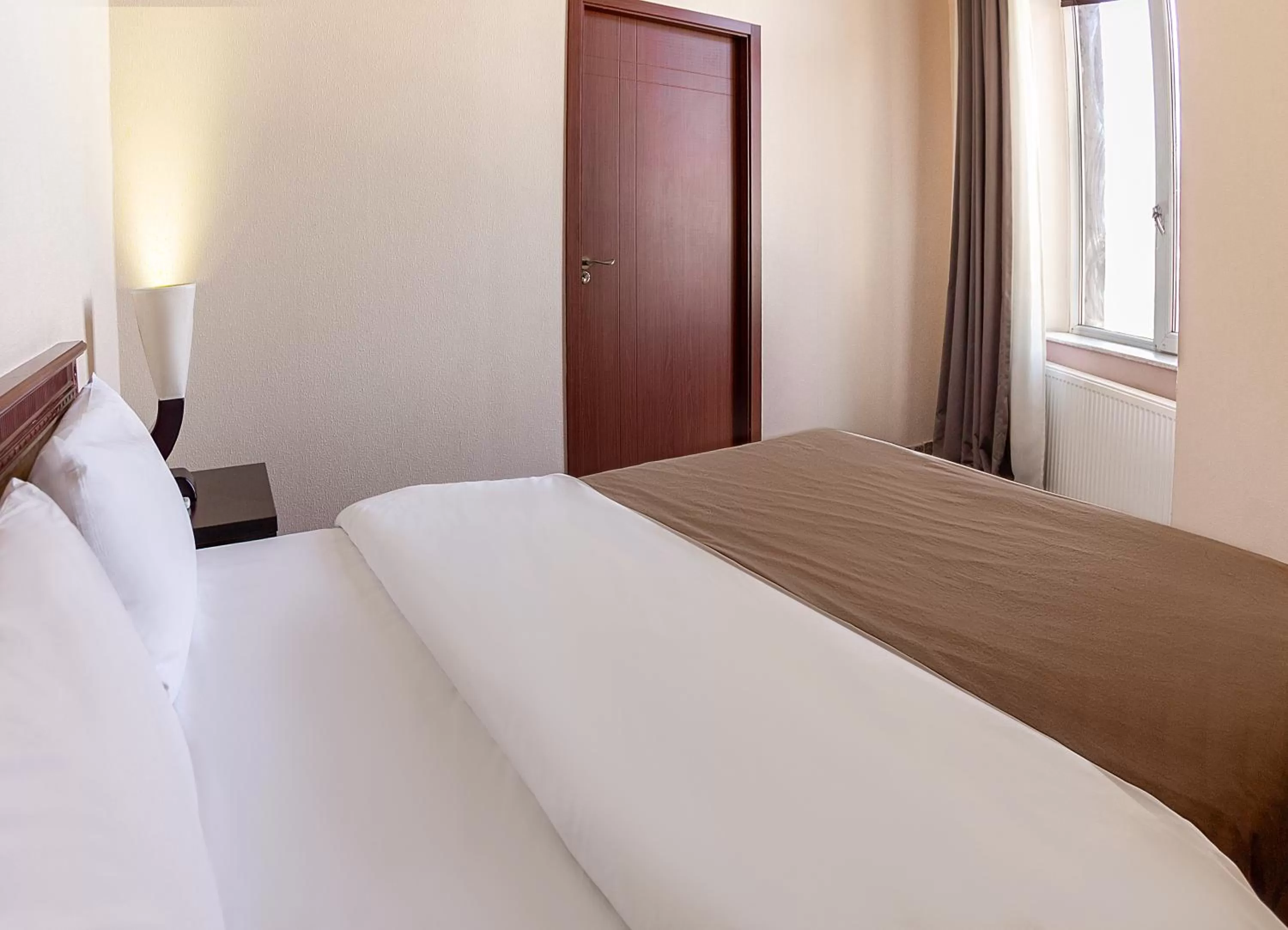 Bed in Margo Palace Hotel