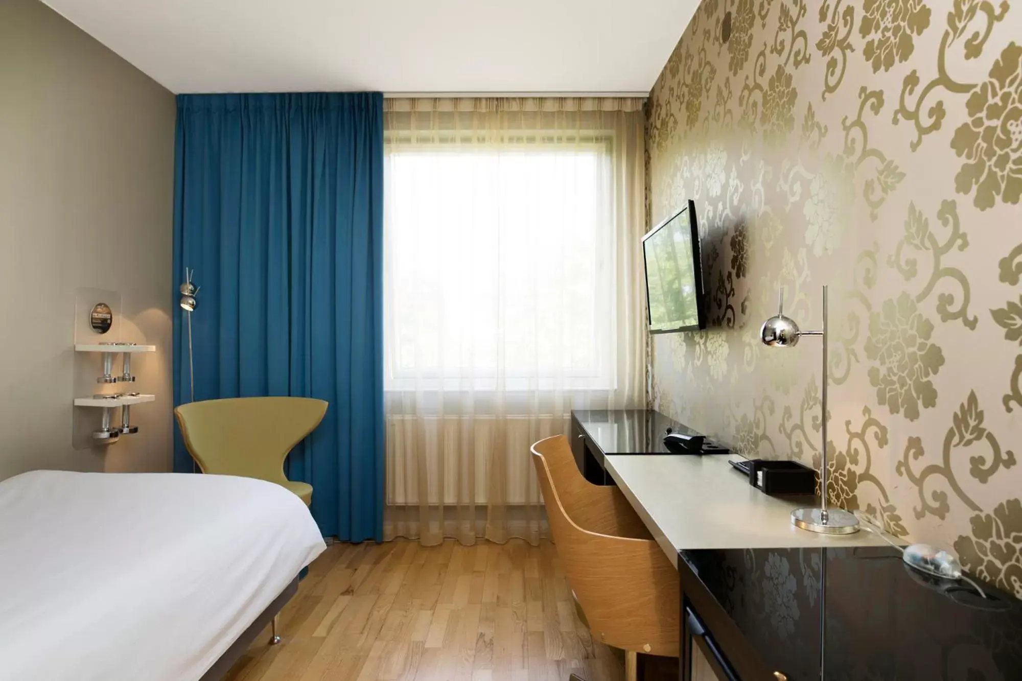 Bedroom in ProfilHotels Savoy