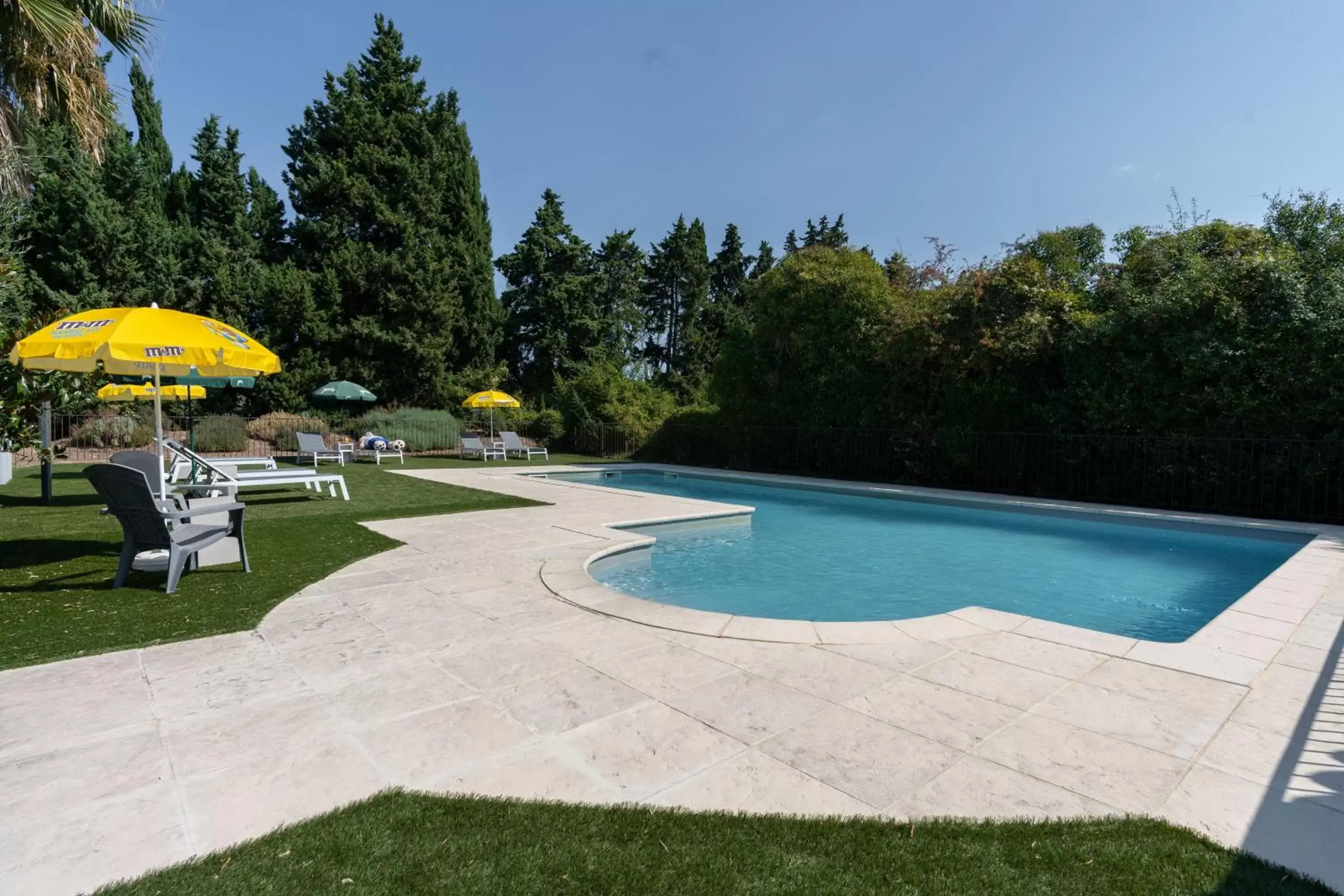 Swimming Pool in Brit Hotel Avignon Sud Le Calendal