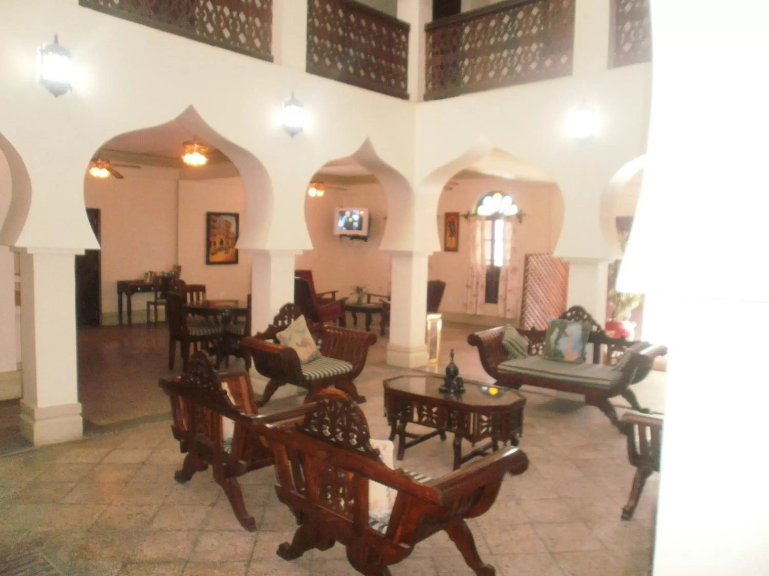 Communal lounge/ TV room, Seating Area in Asmini Palace Hotel