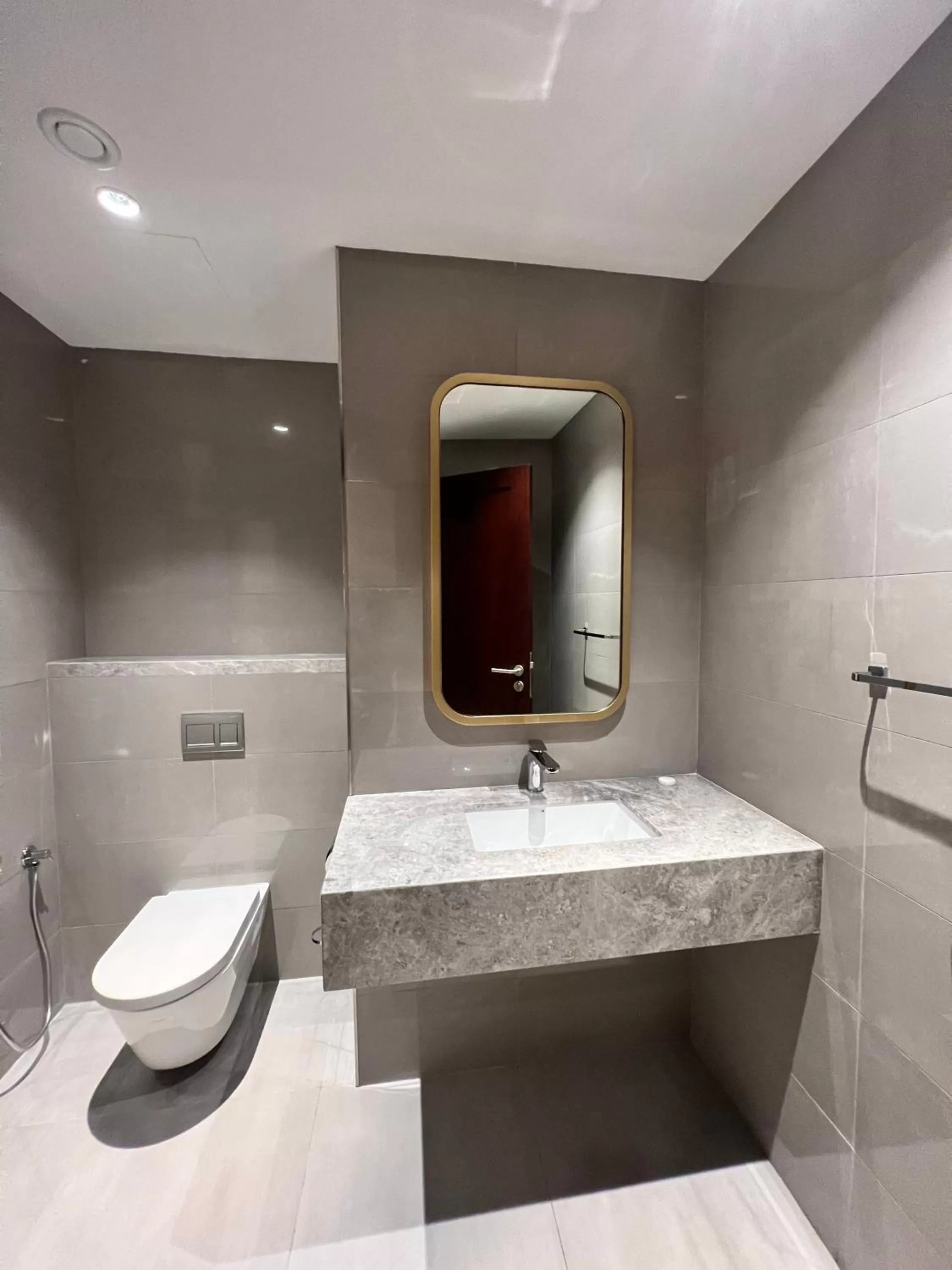 Toilet in City Seasons Suites