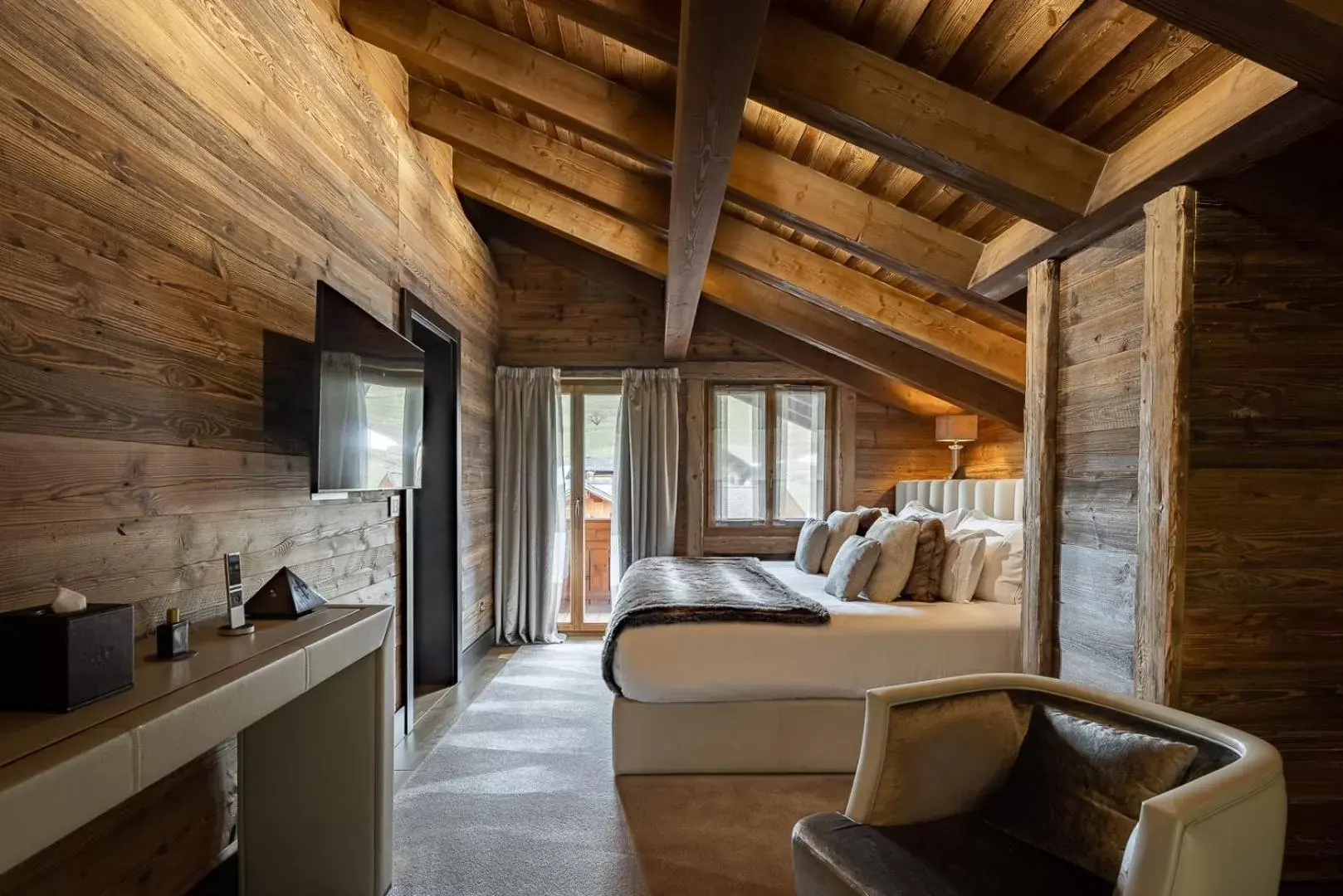 Bedroom, Seating Area in Ultima Gstaad