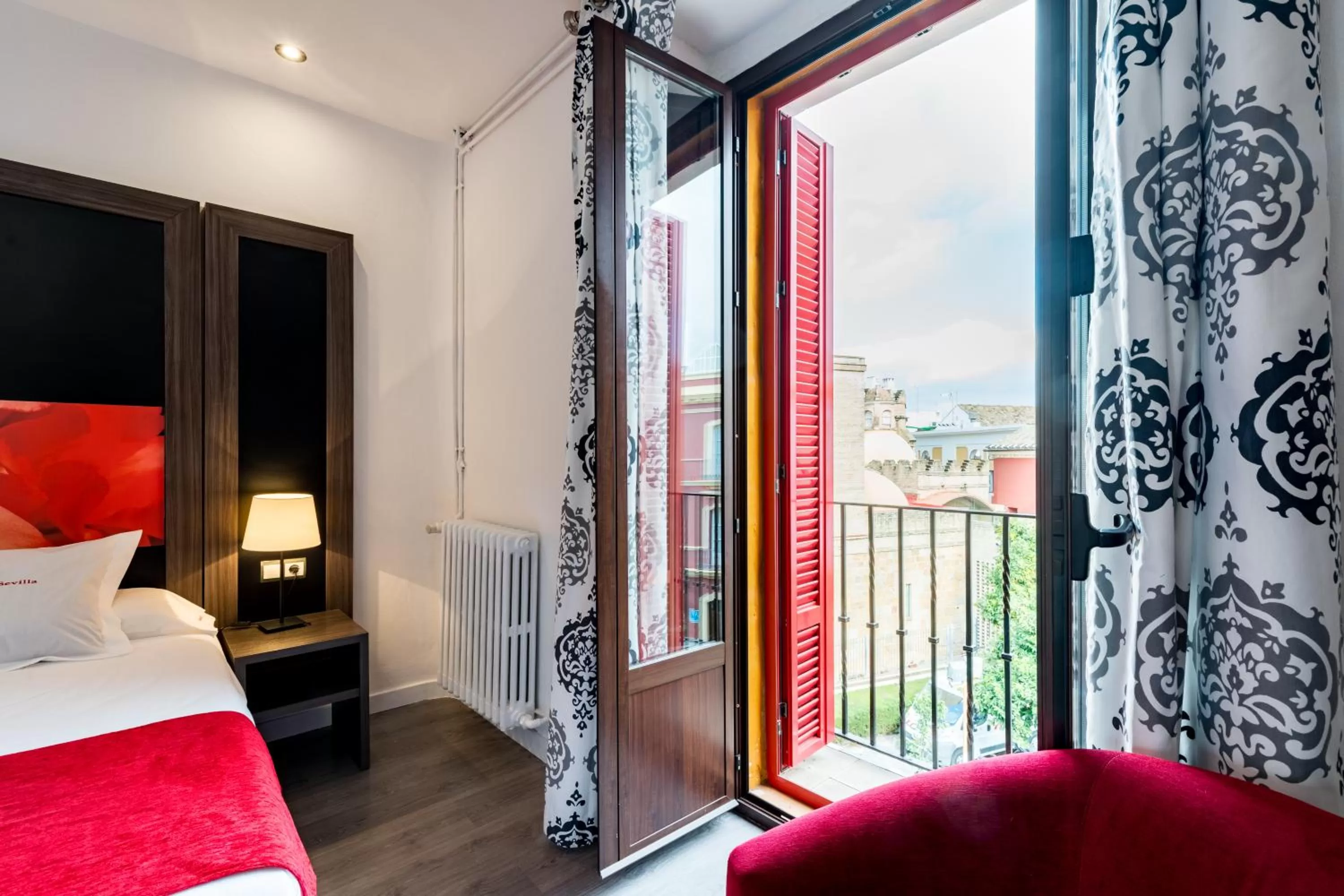 Balcony/Terrace, Bed in Hotel Sevilla