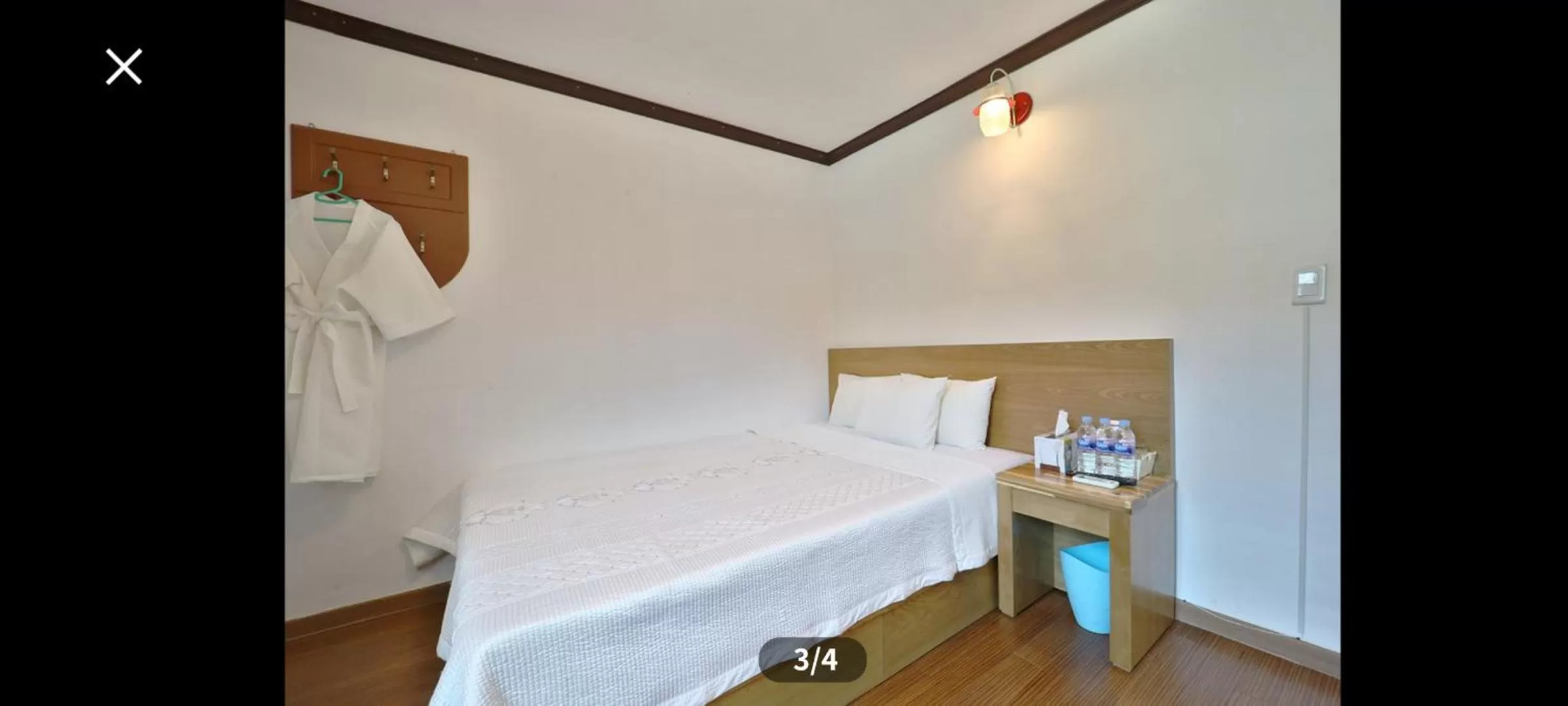 Bed in Saipan Motel with Sea View