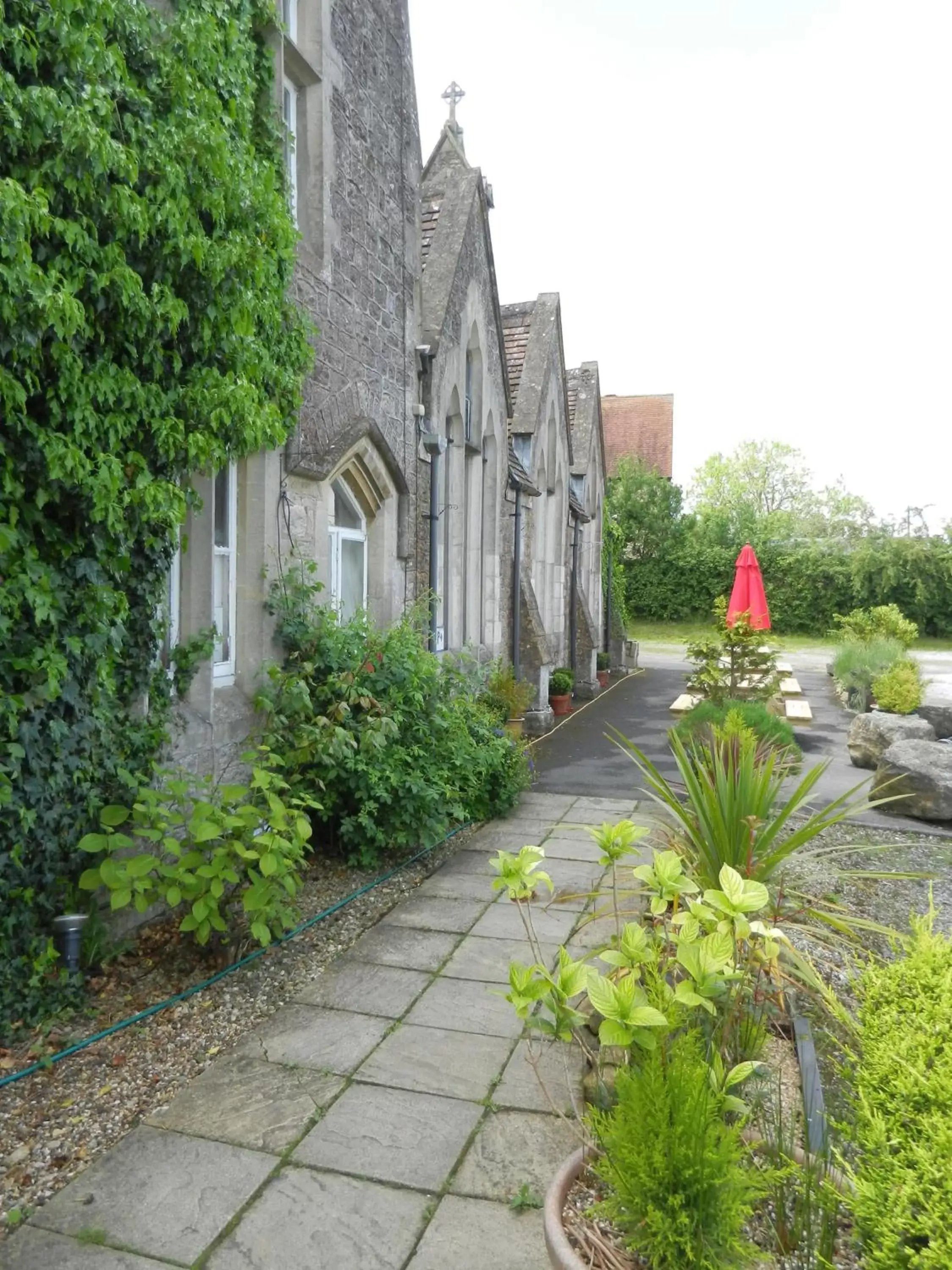 Patio, Property Building in Schoolhouse Restaurant and Hotel