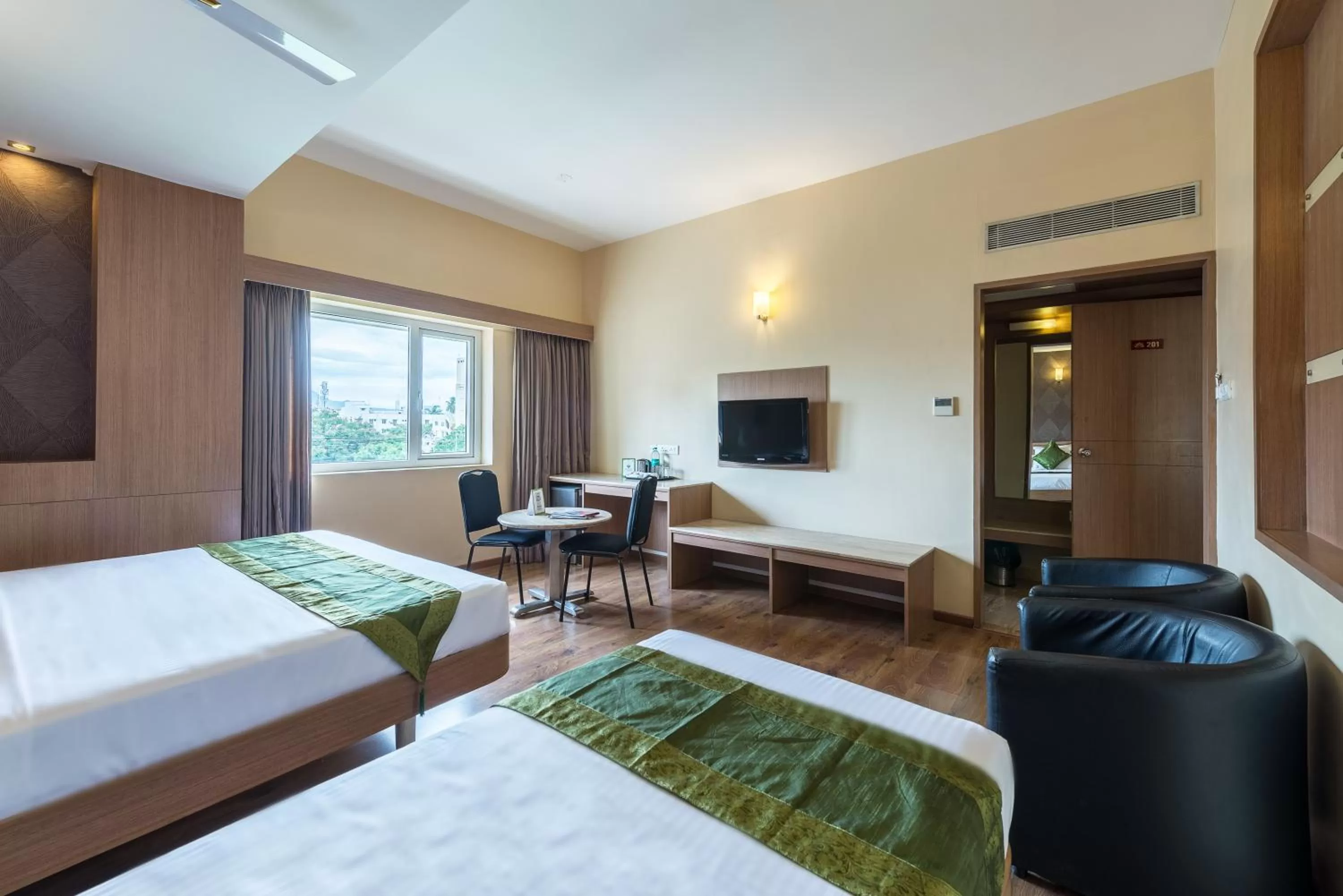 Bed in Treebo ESS Grande