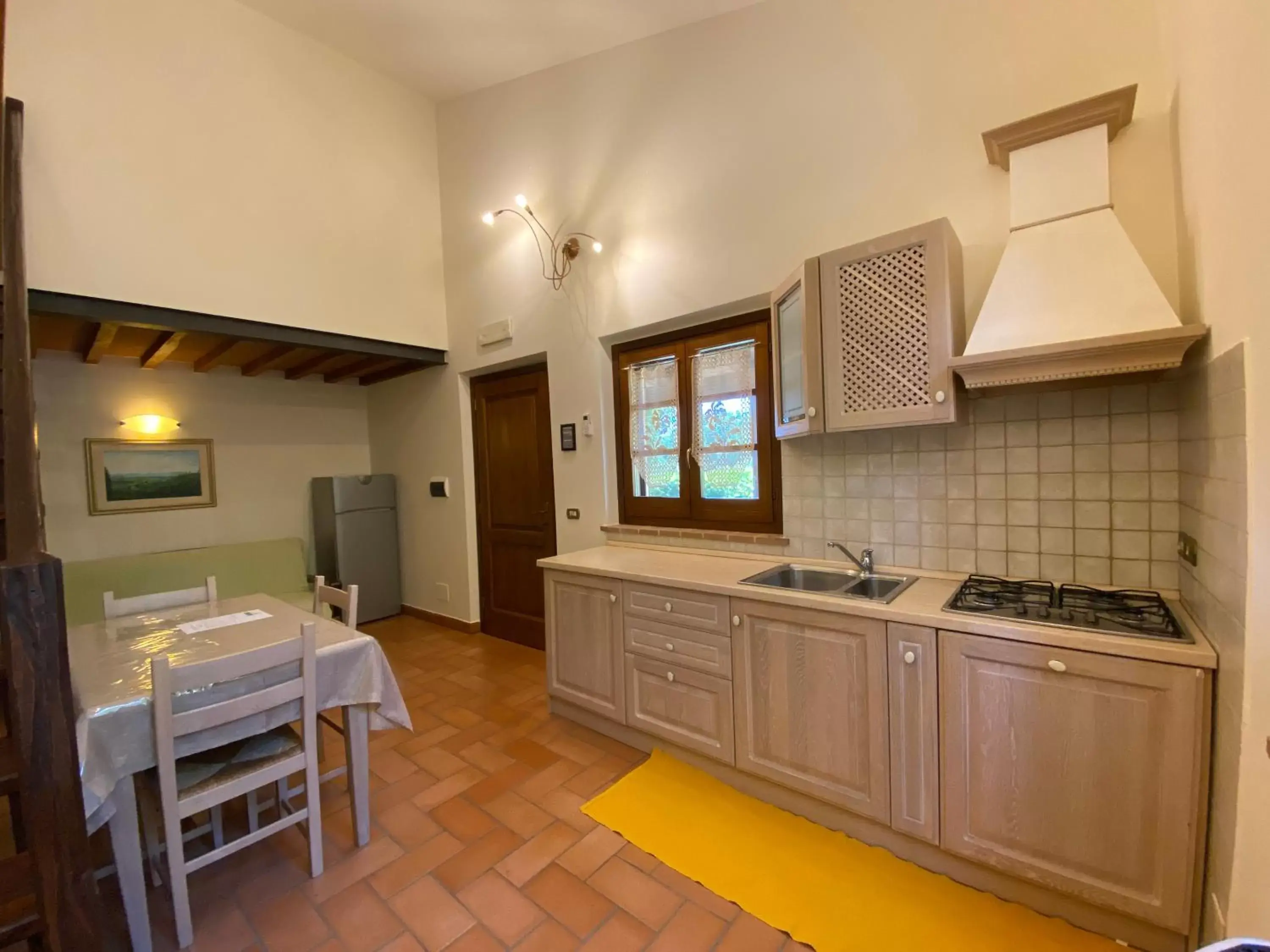 Living room, Kitchen/Kitchenette in Tenuta Badia '99